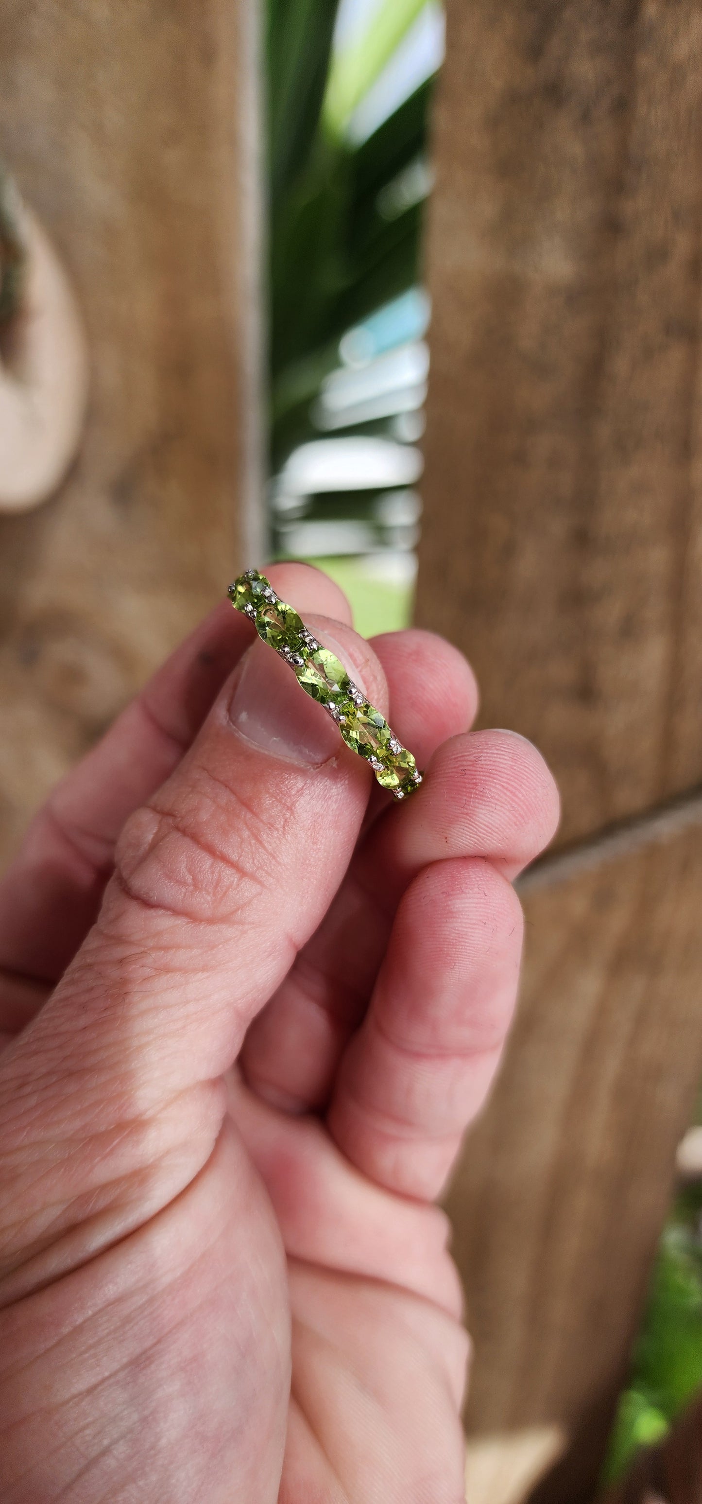Sterling Silver and Faceted Oval cut Green Peridot Full Eternity ring.