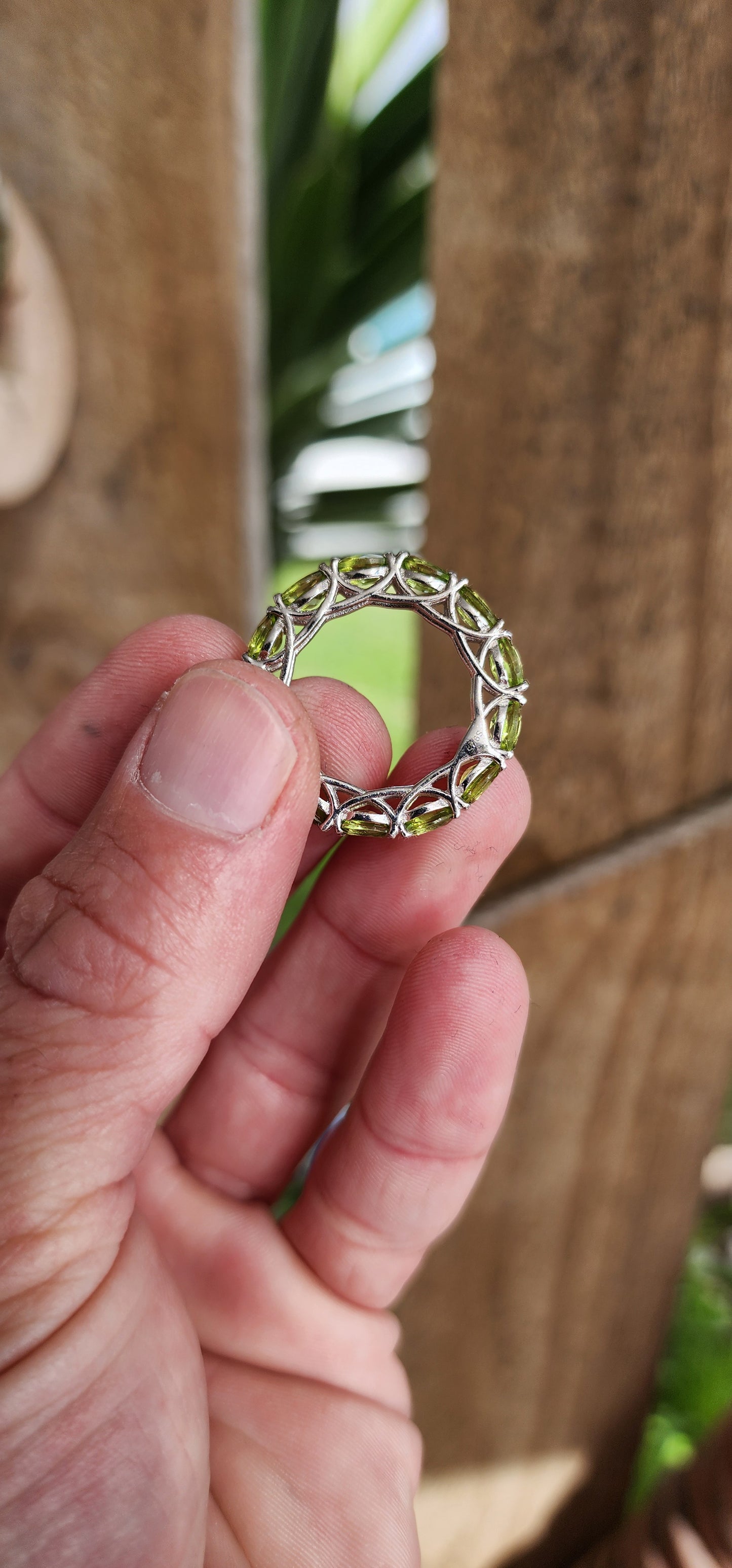 Sterling Silver and Faceted Oval cut Green Peridot Full Eternity ring.