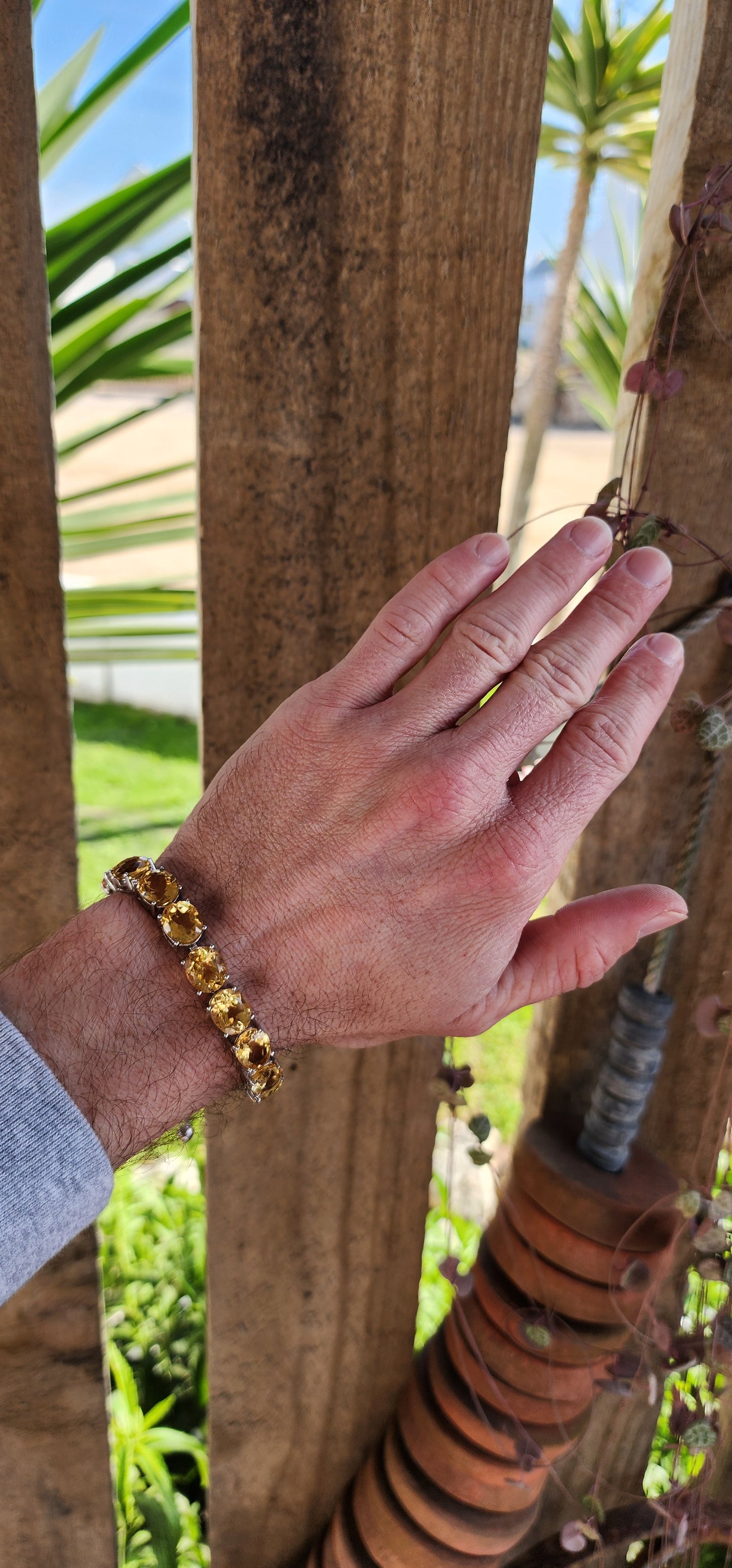 This gorgeous and STATEMENT Tennis style bracelet is crafted in Sterling Silver and features 9x large sized Oval Faceted Cut Yellow Citrine Gemstones.