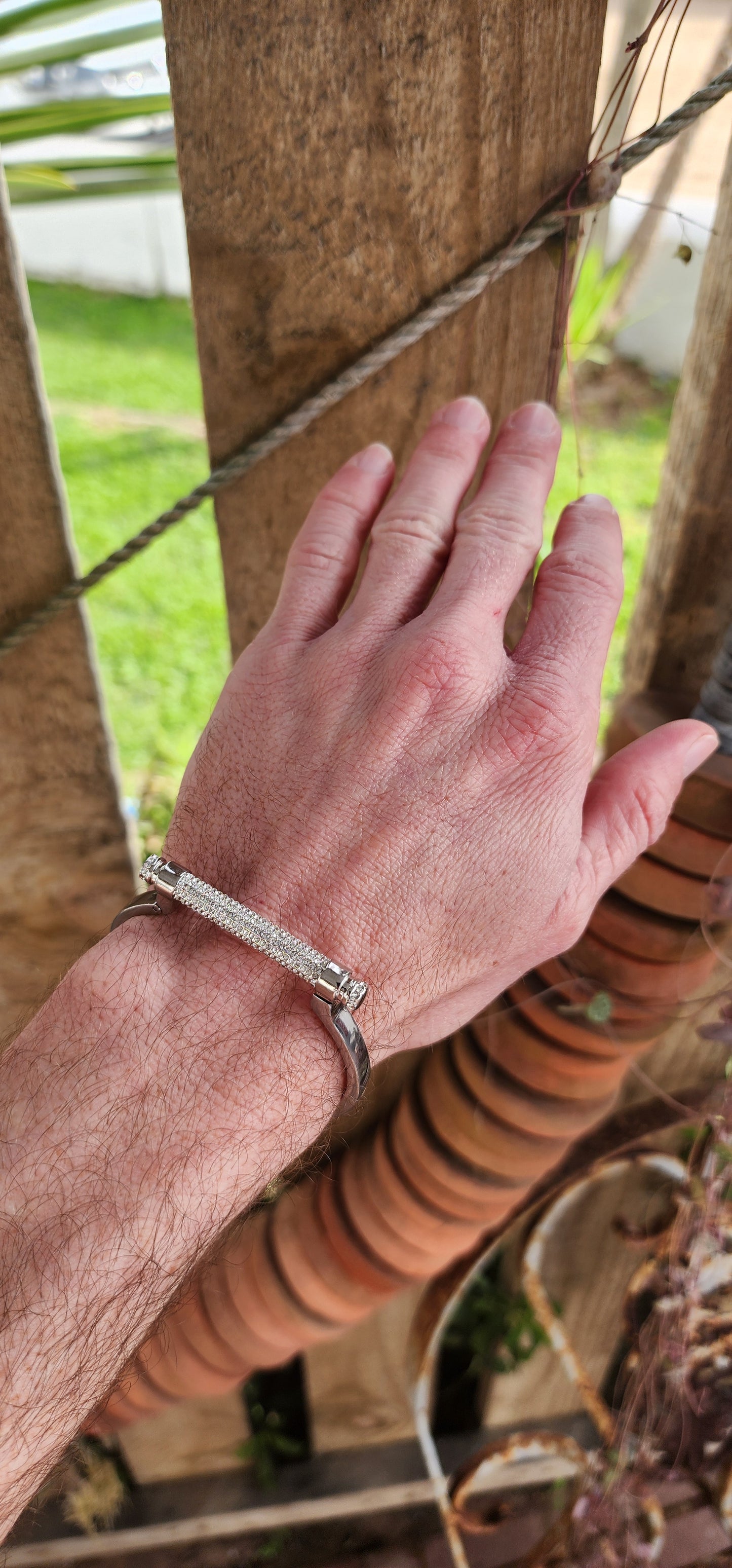 Swarovski Silvertone "Friend" narrow Manetta bangle/bracelet.
Rhodium-plated bracelet with pavé white Swarovski crystals.