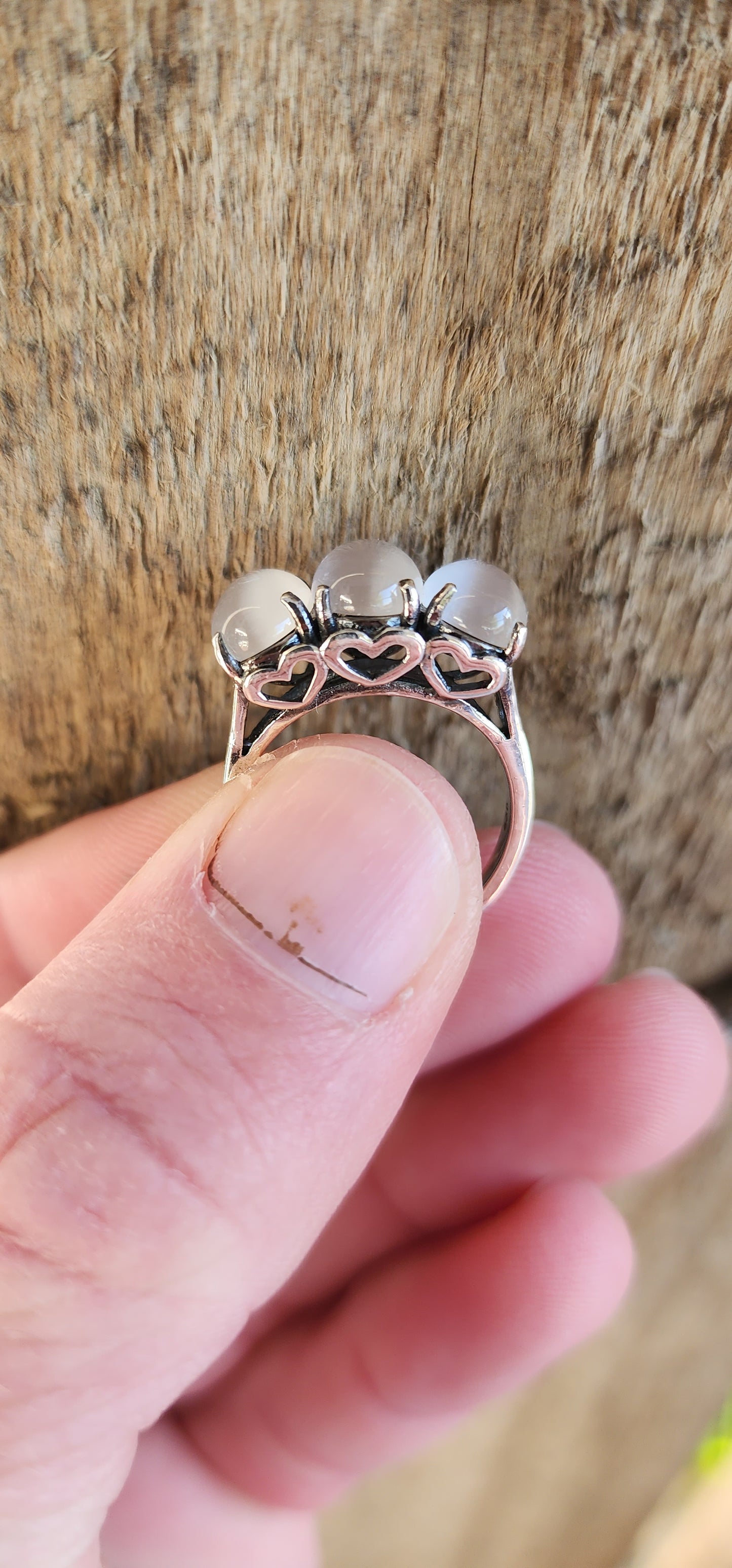 Sterling Silver and Oval Cat's Eye Moonstone Cabochon Gemstones Trilogy ring .The little pierced Hearts on the sides of this ring add that extra special touch.
