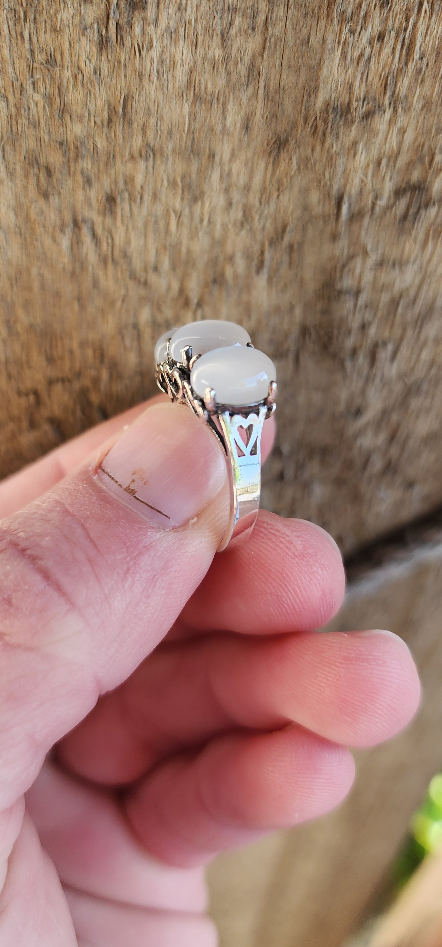 Sterling Silver and Oval Cat's Eye Moonstone Cabochon Gemstones Trilogy ring .The little pierced Hearts on the sides of this ring add that extra special touch.