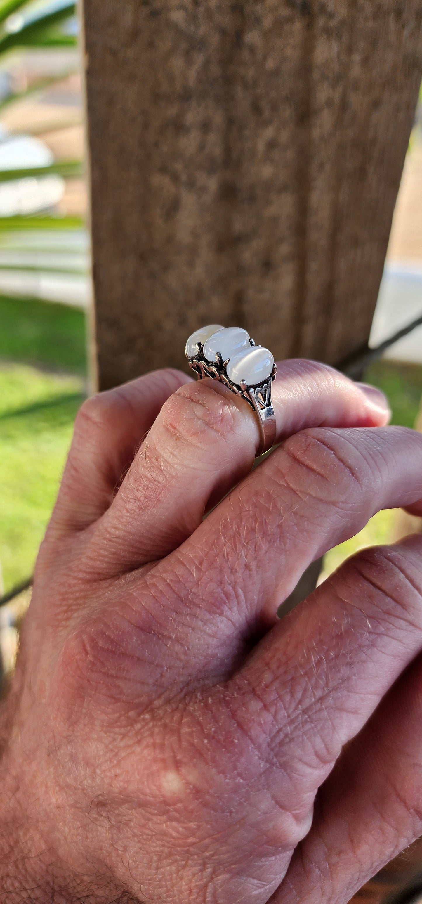 Sterling Silver and Oval Cat's Eye Moonstone Cabochon Gemstones Trilogy ring .The little pierced Hearts on the sides of this ring add that extra special touch.
