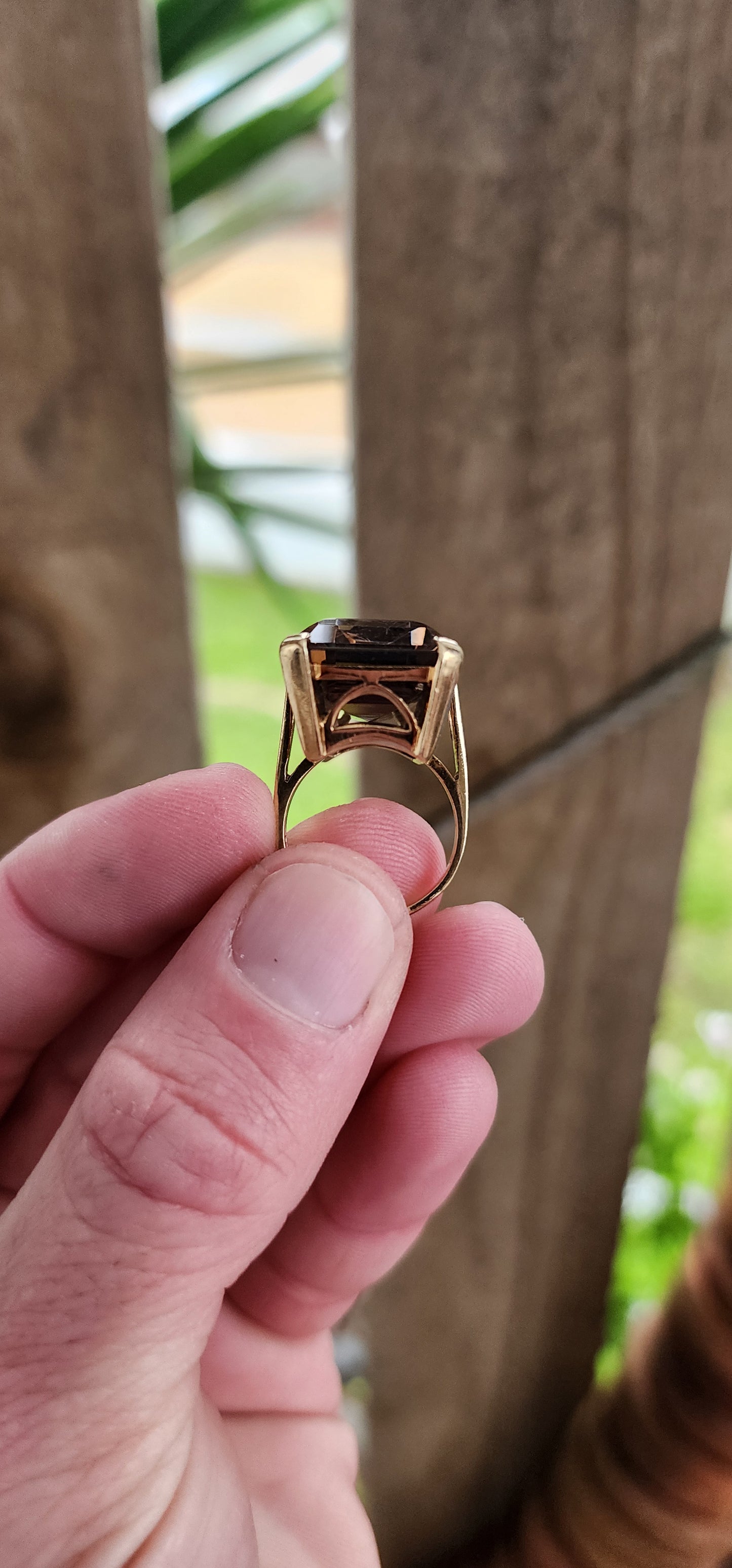 Marvelous Vintage Designer 1950s statement Cocktail/Dress ring featuring a super large Emerald cut Smokey Quartz Gemstone claw-set in a ornate 9ct Yellow Gold Art Deco basket setting. The ring is an STATEMENT piece!!