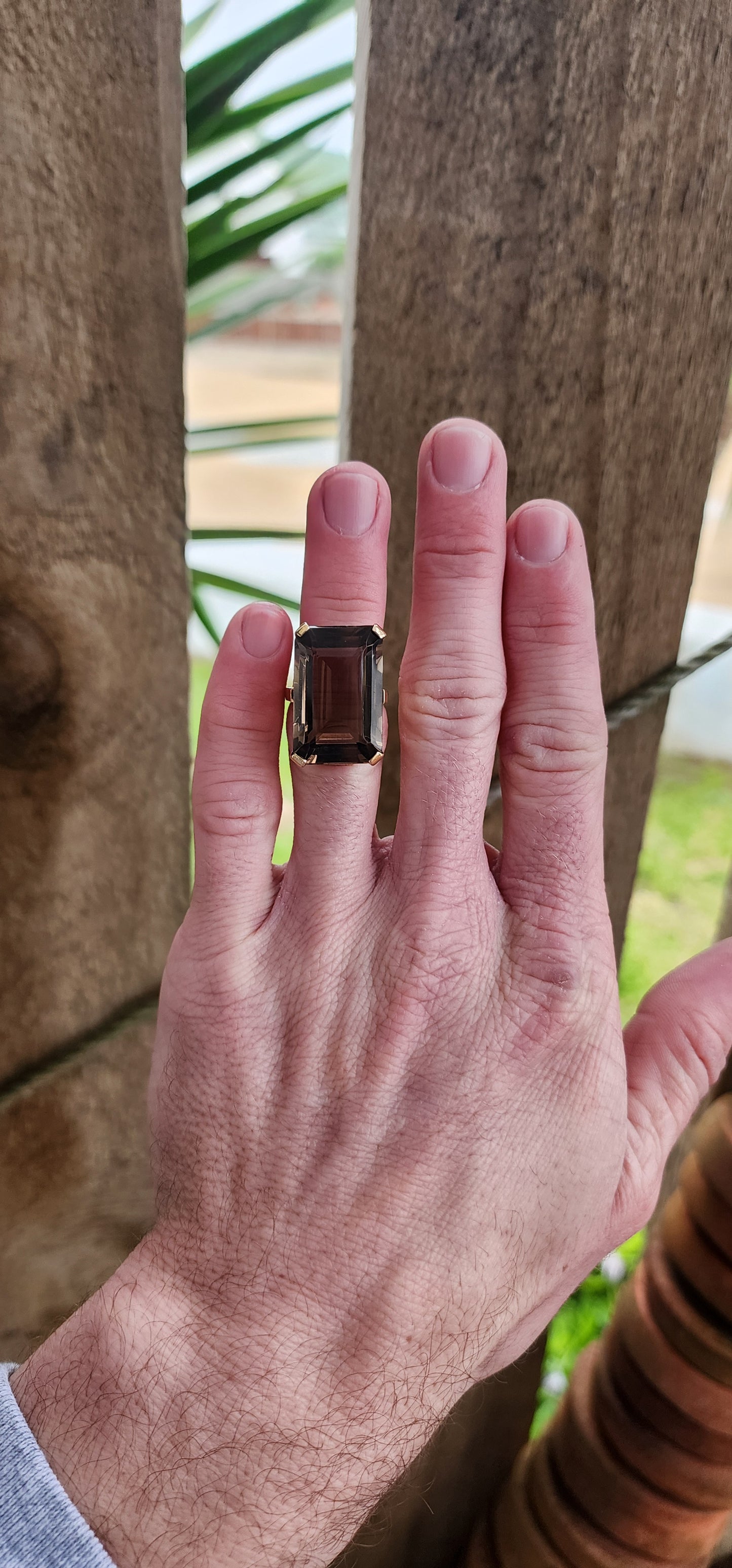 Marvelous Vintage Designer 1950s statement Cocktail/Dress ring featuring a super large Emerald cut Smokey Quartz Gemstone claw-set in a ornate 9ct Yellow Gold Art Deco basket setting. The ring is an STATEMENT piece!!