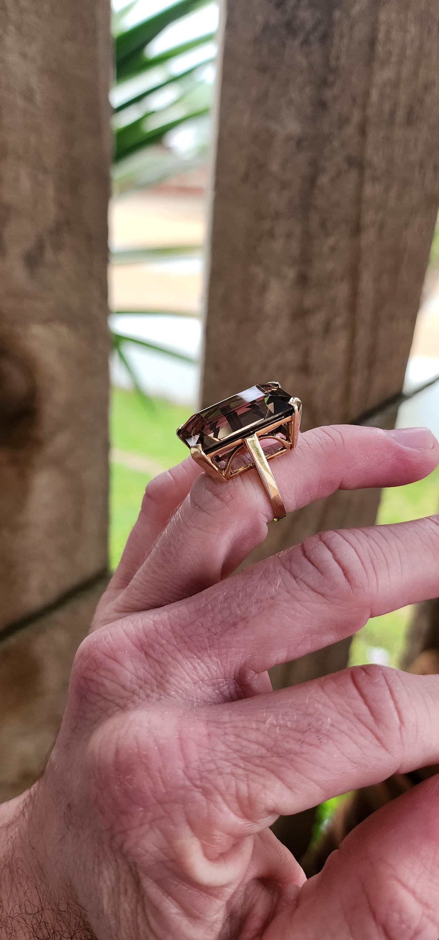 Marvelous Vintage Designer 1950s statement Cocktail/Dress ring featuring a super large Emerald cut Smokey Quartz Gemstone claw-set in a ornate 9ct Yellow Gold Art Deco basket setting. The ring is an STATEMENT piece!!