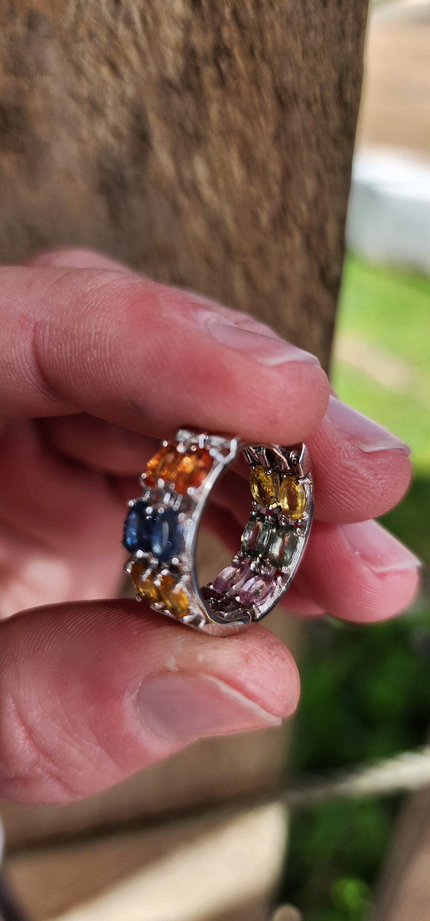 Gorgeous pair of Sterling Silver and multicolor Sapphire Gemstones Huggies/Hoop earrings .Each earring set with 6x Oval Faceted Cut Sapphires.