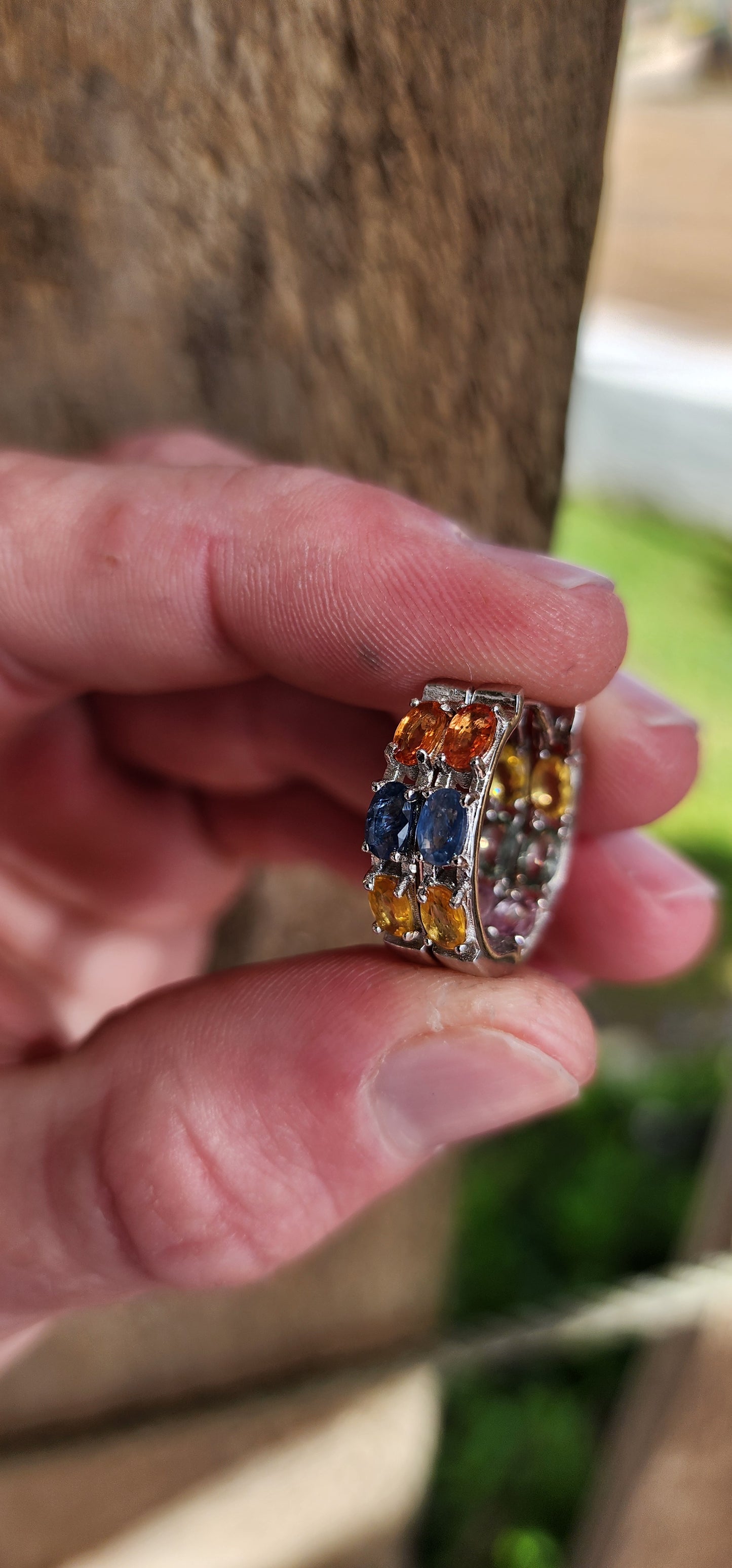 Gorgeous pair of Sterling Silver and multicolor Sapphire Gemstones Huggies/Hoop earrings .Each earring set with 6x Oval Faceted Cut Sapphires.