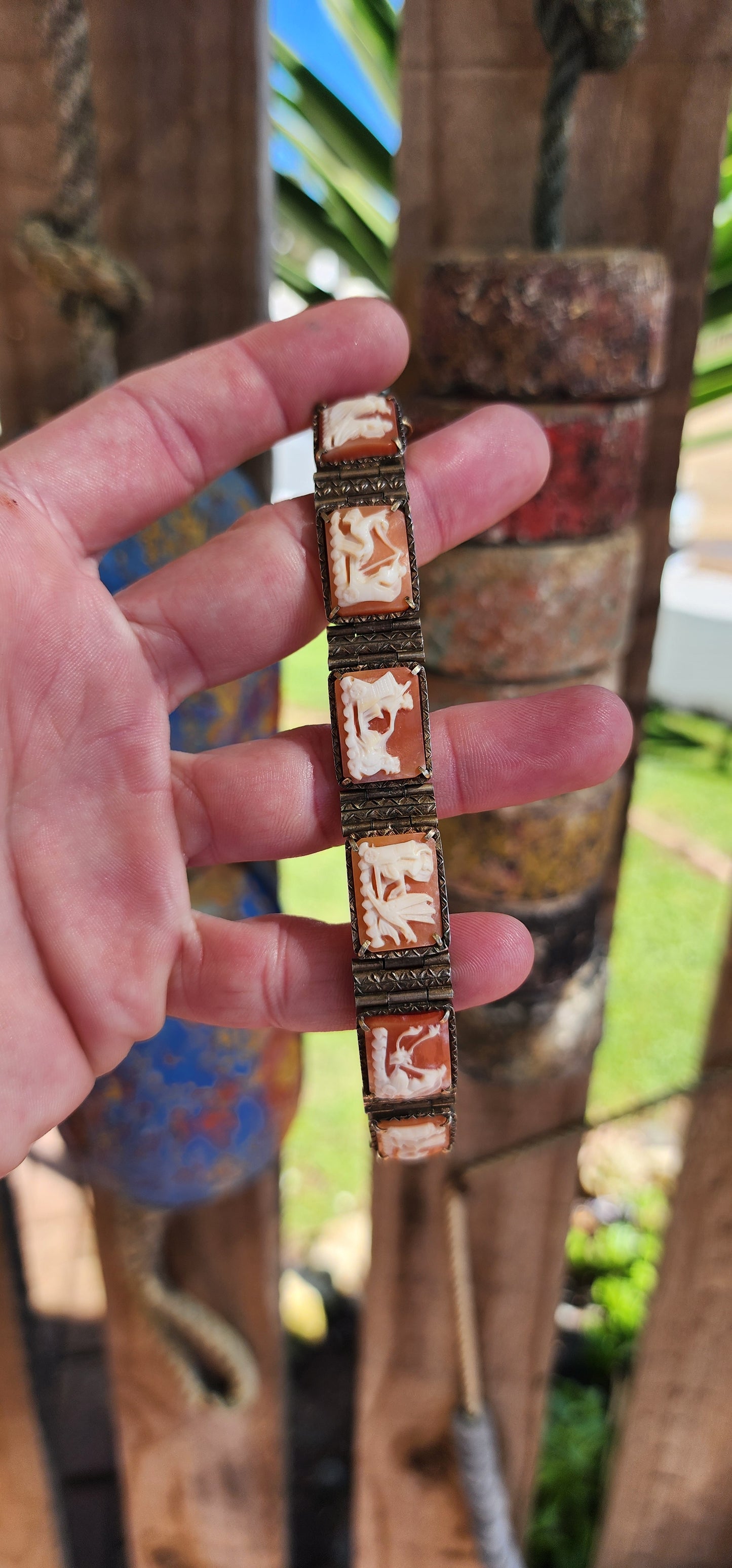 An extraordinary and rare Antique Victorian Italian Sardonyx Cameo Mythology 7-panel bracelet. Hand-carved and in a lovely 800 silver setting, this bracelet features stunning scenes of Roman gods racing chariots representing the days of the week.