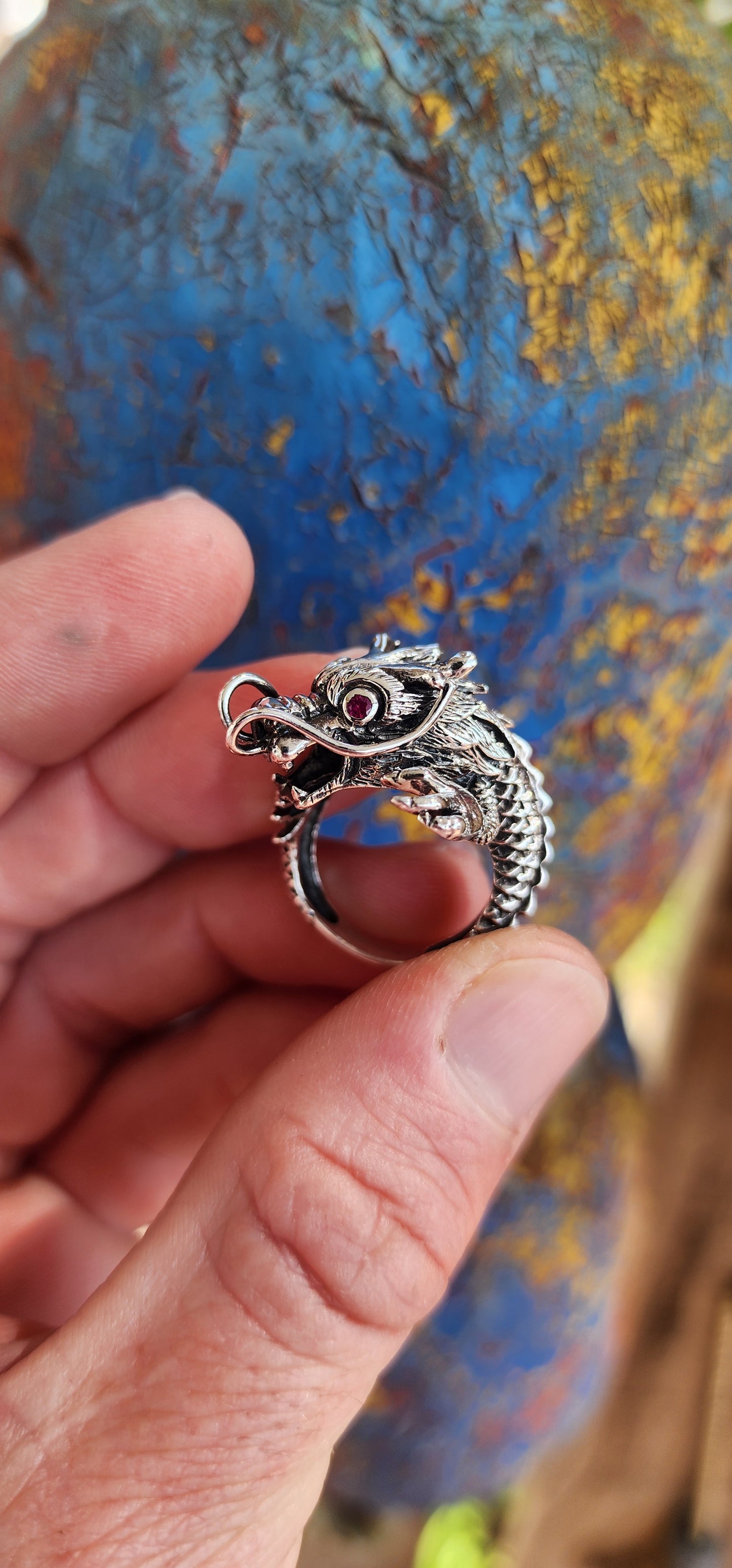 This chunky statement Sterling Silver Red Eye Dragon Novelty Ring draws inspiration from Oriental and Gothic styles, making it a truly eye-catching beauty.