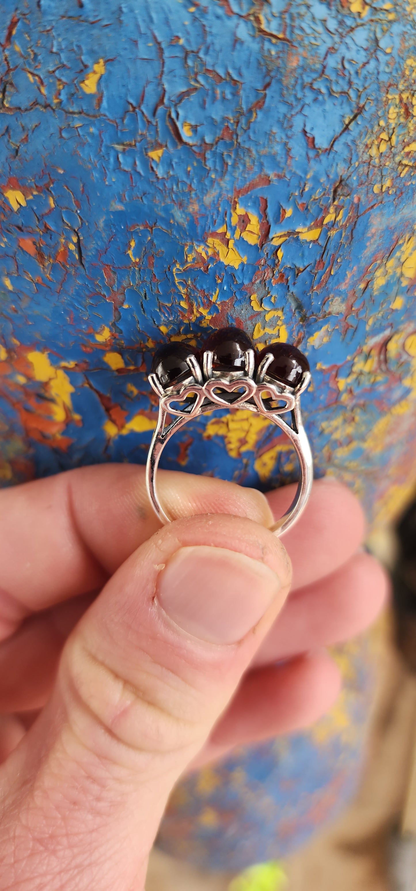 JELLY BABY!!Beautiful Sterling Silver and prong set Oval Garnet Cabochons Trilogy ring.
The little pierced Hearts on the sides of this ring add that extra special touch.