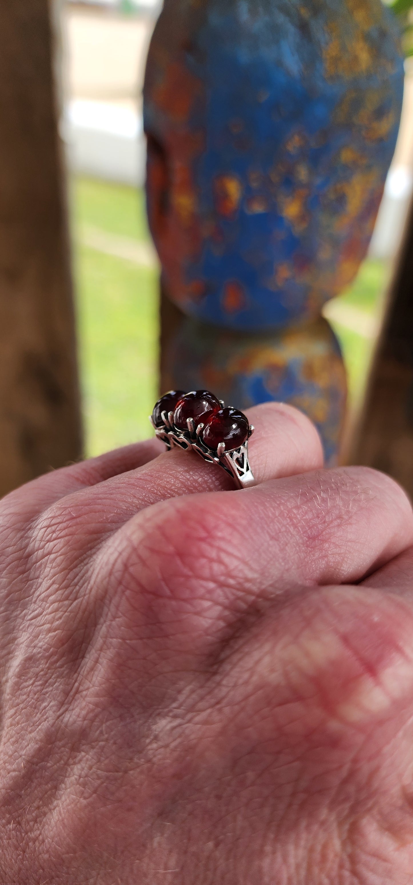 JELLY BABY!!Beautiful Sterling Silver and prong set Oval Garnet Cabochons Trilogy ring.
The little pierced Hearts on the sides of this ring add that extra special touch.