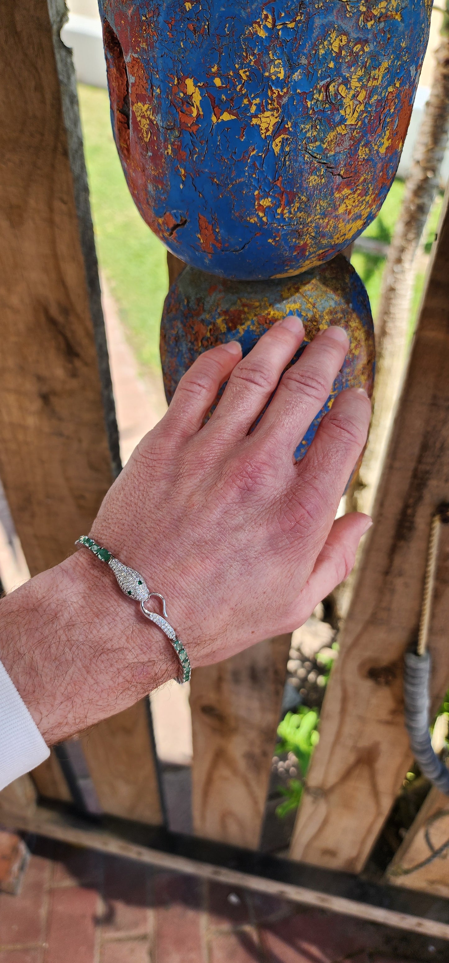 Thia incredible Serpent bracelet is a real piece of jewelry art! The bracelet is made of high quality Sterling Silver and Natural Oval cut Emerald Gemstones.