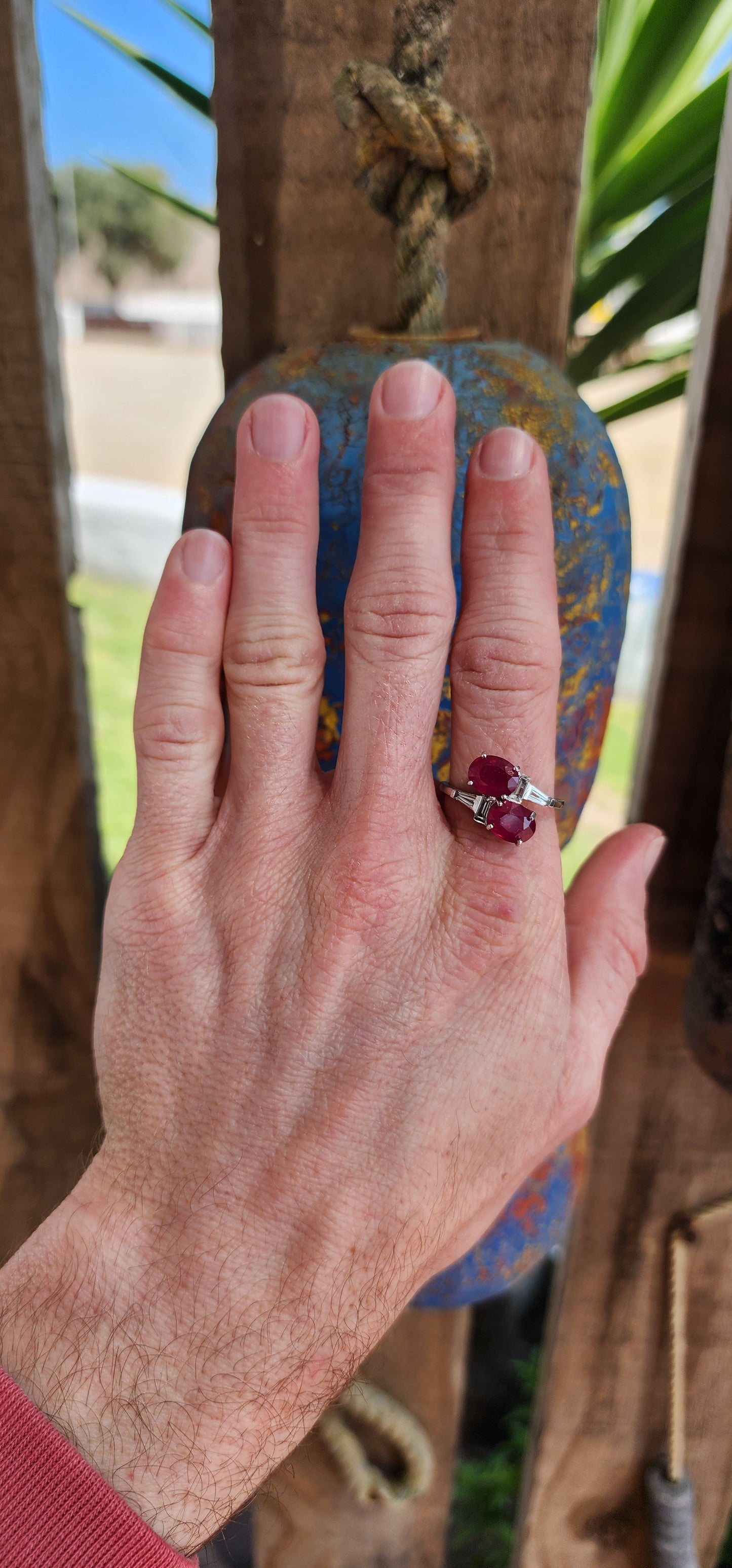 Beyond gorgeous, this trilogy style Oval cut Rubellite Tourmaline ring studded with Baguette cut CZ Gemstones along the Sterling Silver band would make a divine engagement ring.