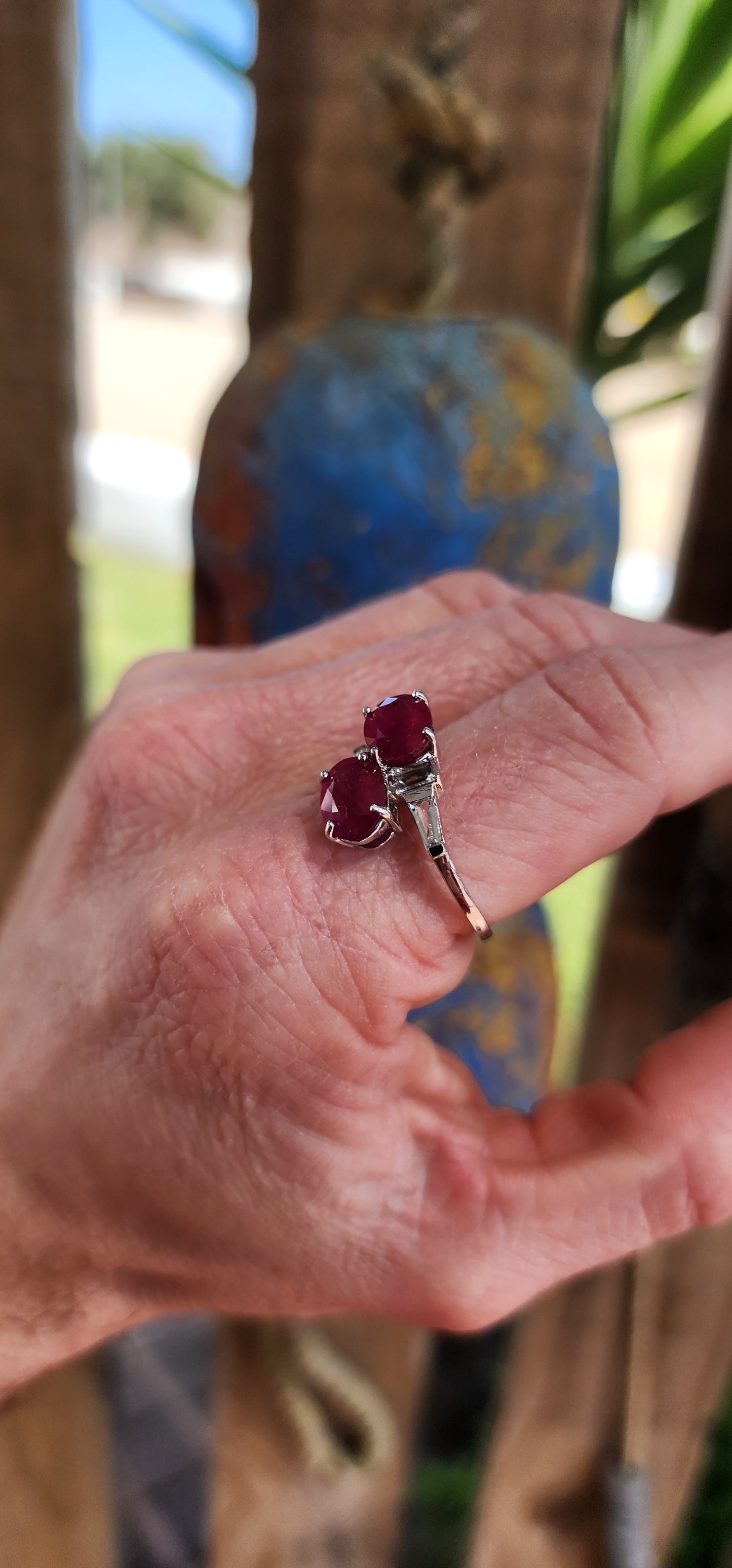 Beyond gorgeous, this trilogy style Oval cut Rubellite Tourmaline ring studded with Baguette cut CZ Gemstones along the Sterling Silver band would make a divine engagement ring.