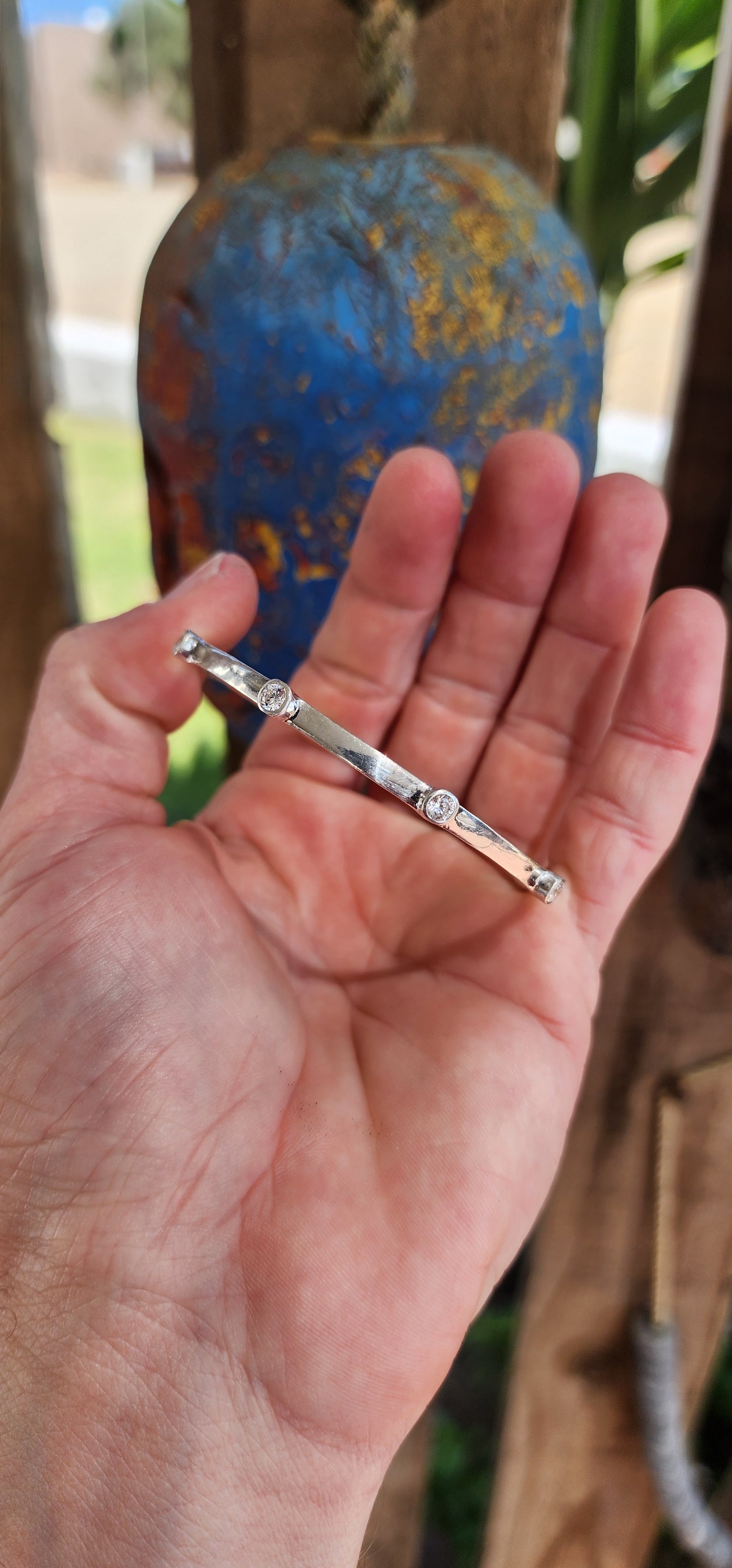 This stylish Sterling Silver flat band bangle will be a perfect addition to your wrist-mess collection!