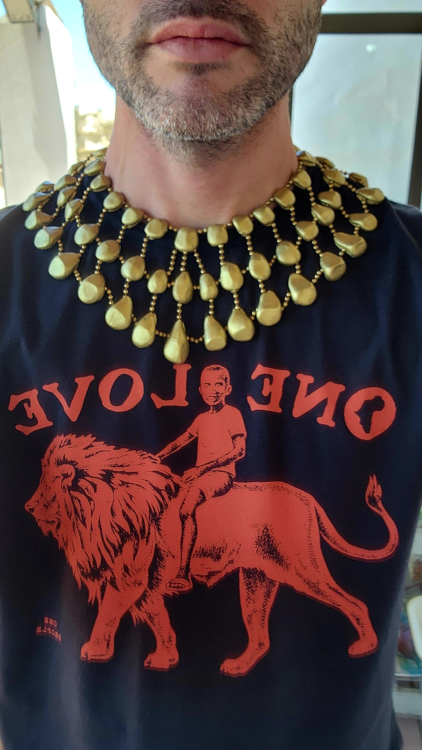 Get ready to channel your inner queen with this jaw-dropping artisan made statement necklace!Crafted from goldtone clay pebbles and Brass chains.