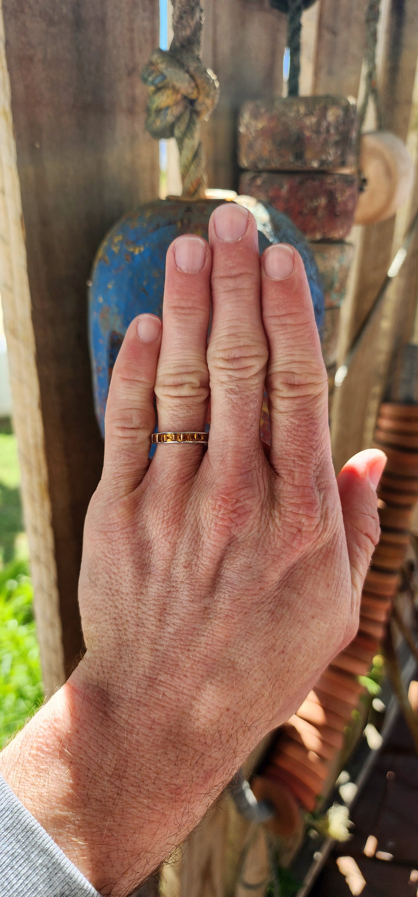 This ring is like a band of sunshine for your finger, perfectly crafted with vibrant, honey-gold Citrine Gemstones that sparkle like captured rays of light.