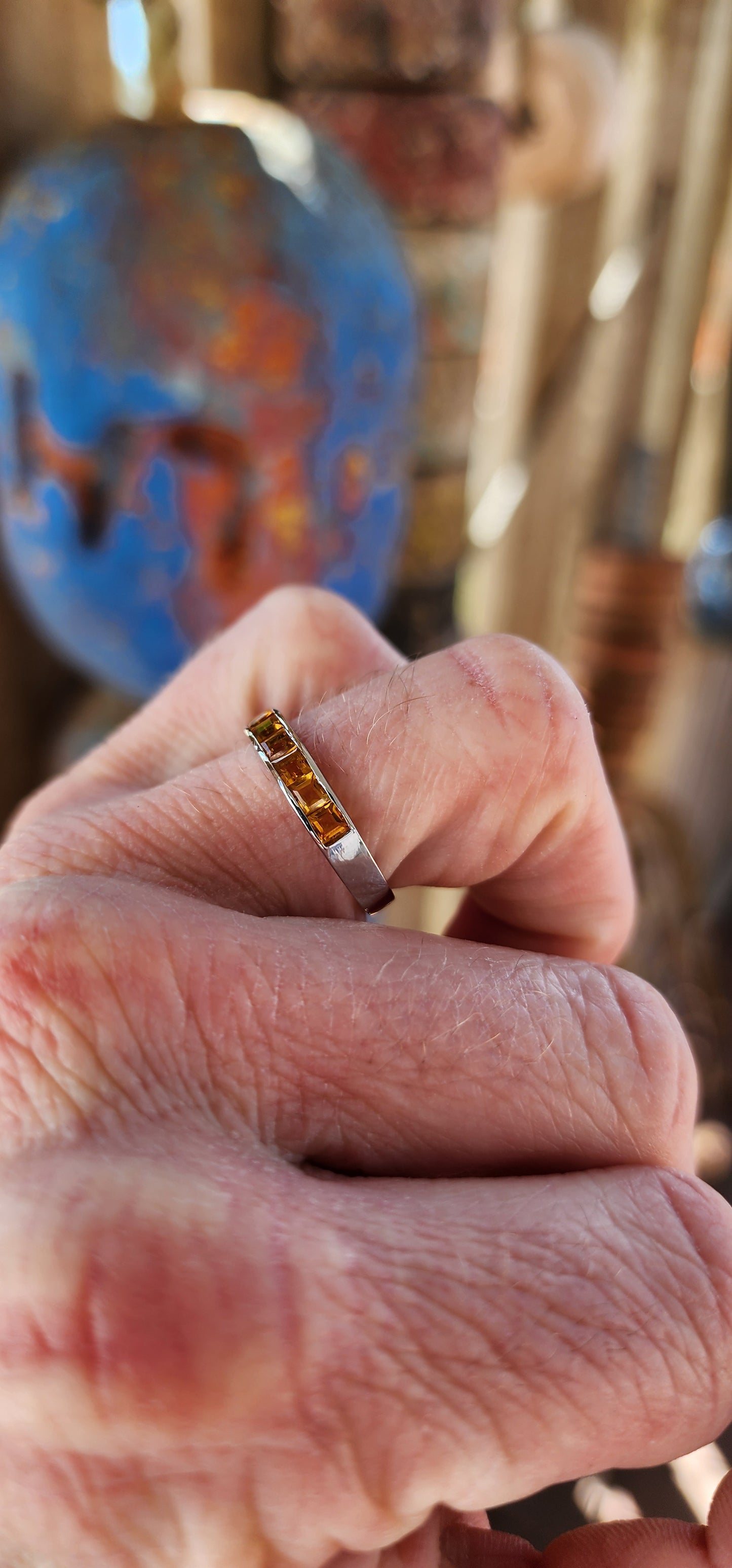 This ring is like a band of sunshine for your finger, perfectly crafted with vibrant, honey-gold Citrine Gemstones that sparkle like captured rays of light.