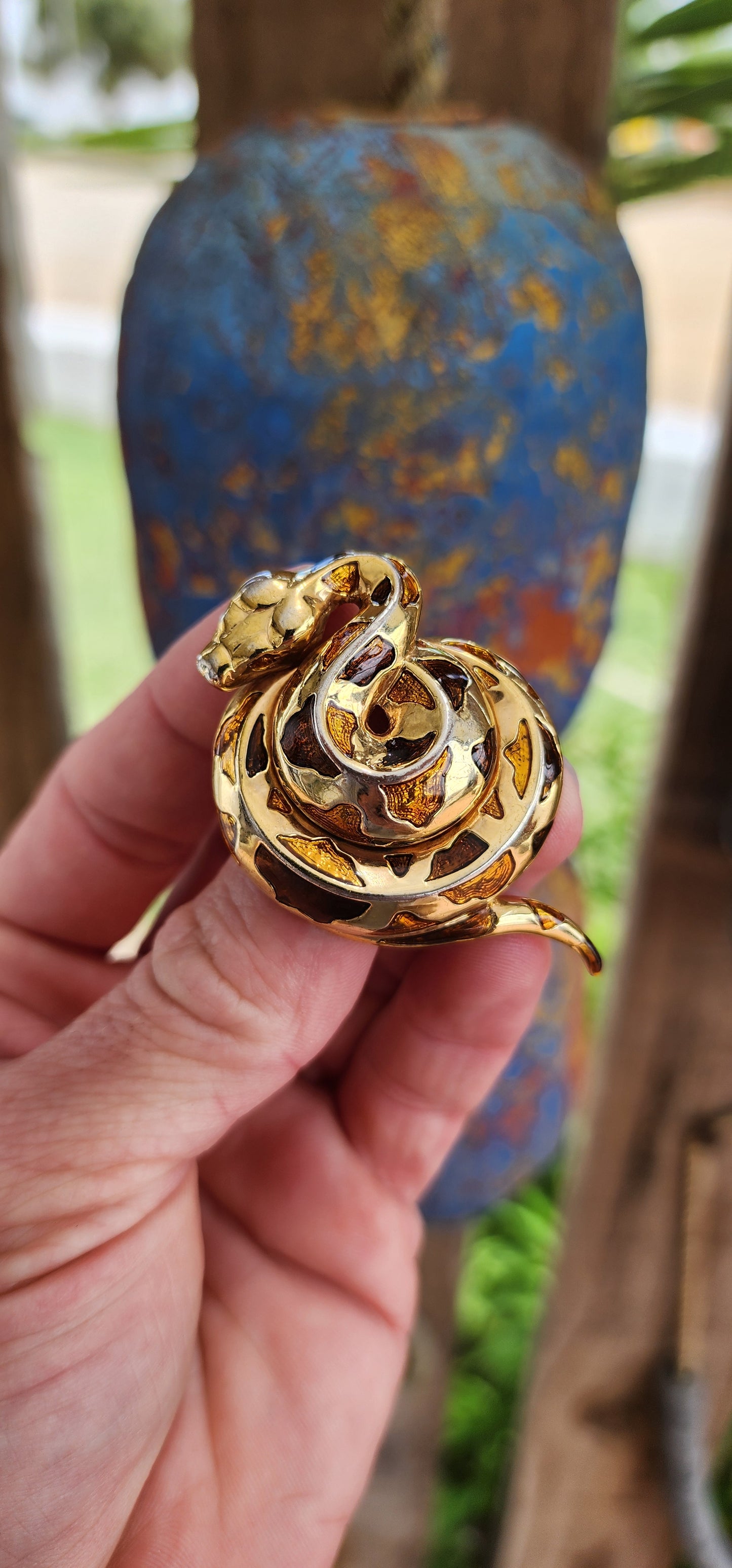 This exquisite vintage 1980s costume brooch captures the serpentine grace and allure of its subject. Designed as a coiled serpent, the brooch is masterfully crafted in gold-plated metal, exuding a warm, luxurious glow.