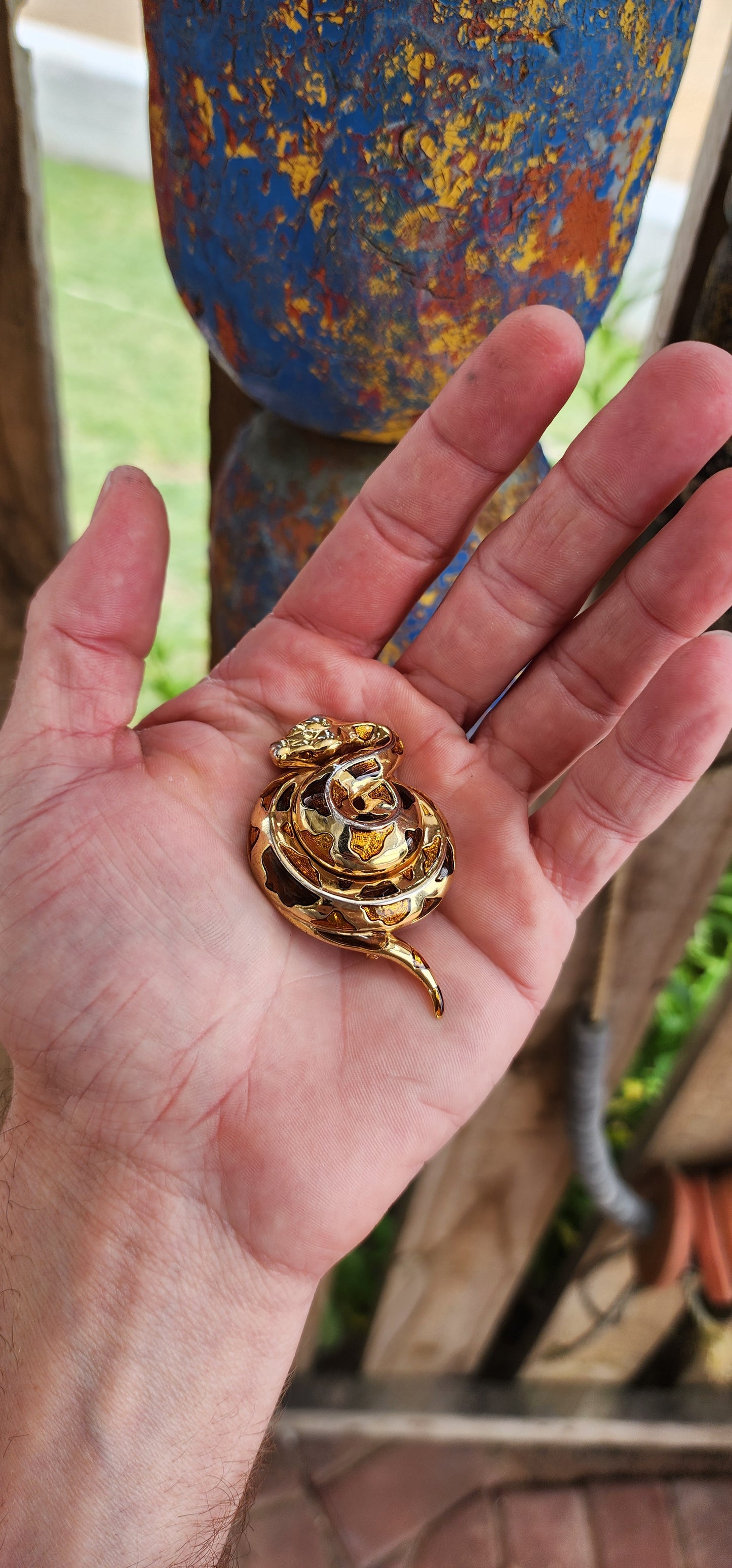 This exquisite vintage 1980s costume brooch captures the serpentine grace and allure of its subject. Designed as a coiled serpent, the brooch is masterfully crafted in gold-plated metal, exuding a warm, luxurious glow.