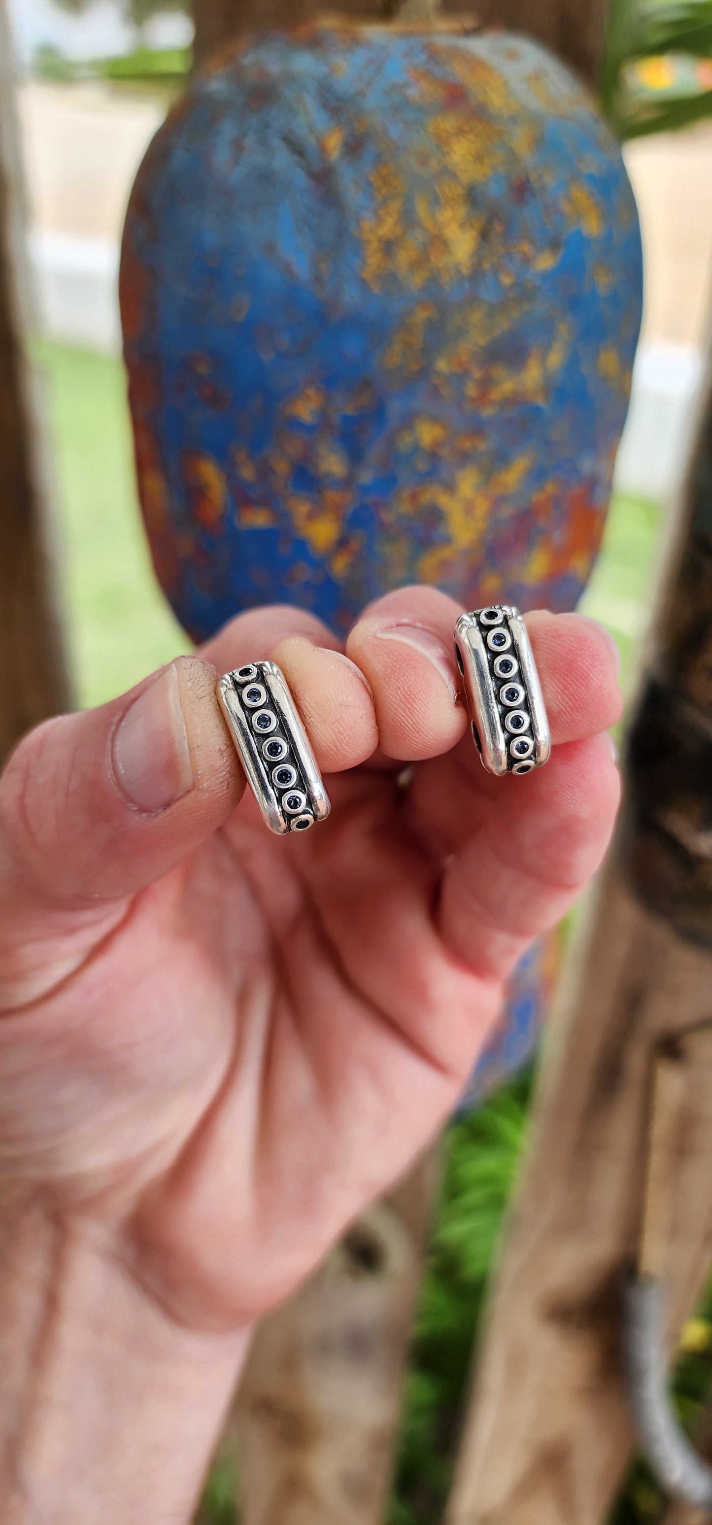 These are a pair of Pandora designer sterling silver bracelet clips "Double Diva", specifically designed to connect multiple bracelets.