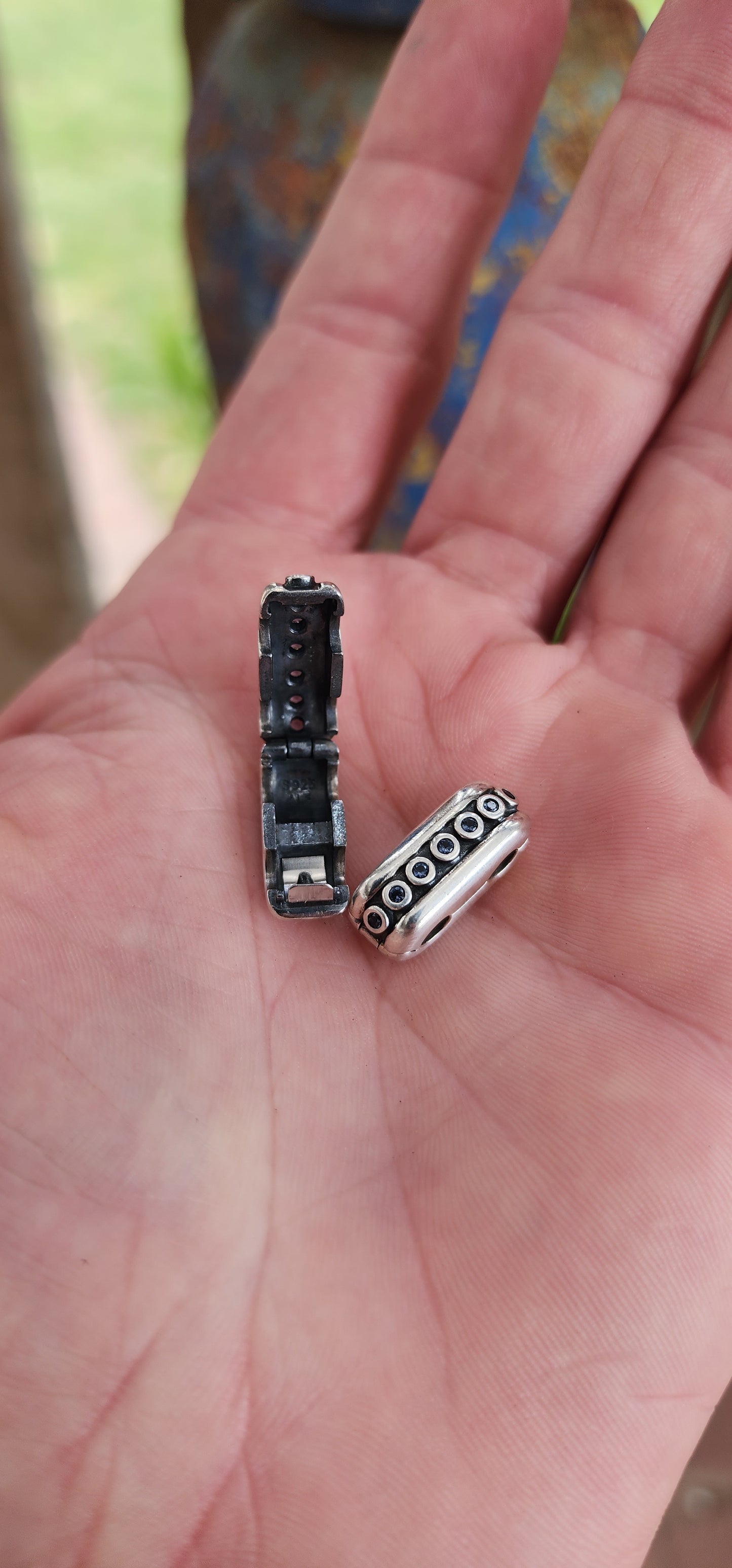 These are a pair of Pandora designer sterling silver bracelet clips "Double Diva", specifically designed to connect multiple bracelets.