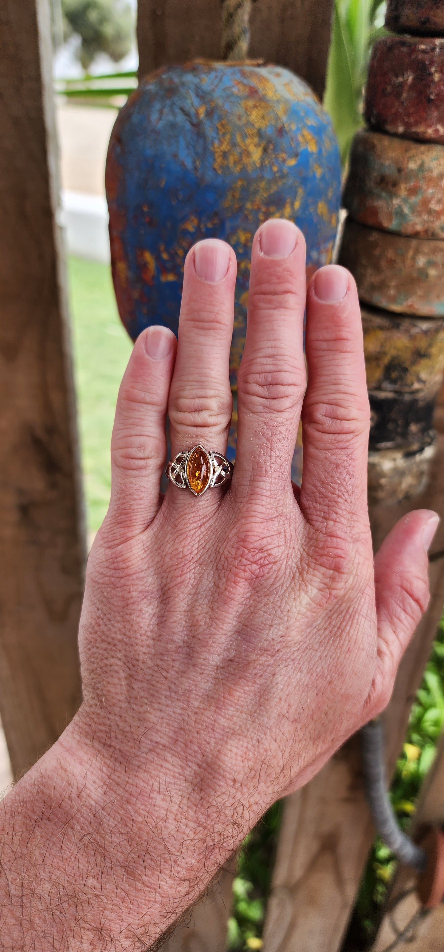 This sterling silver ring is a masterpiece of both elegance and symbolism, its design rooted in ancient Celtic tradition.