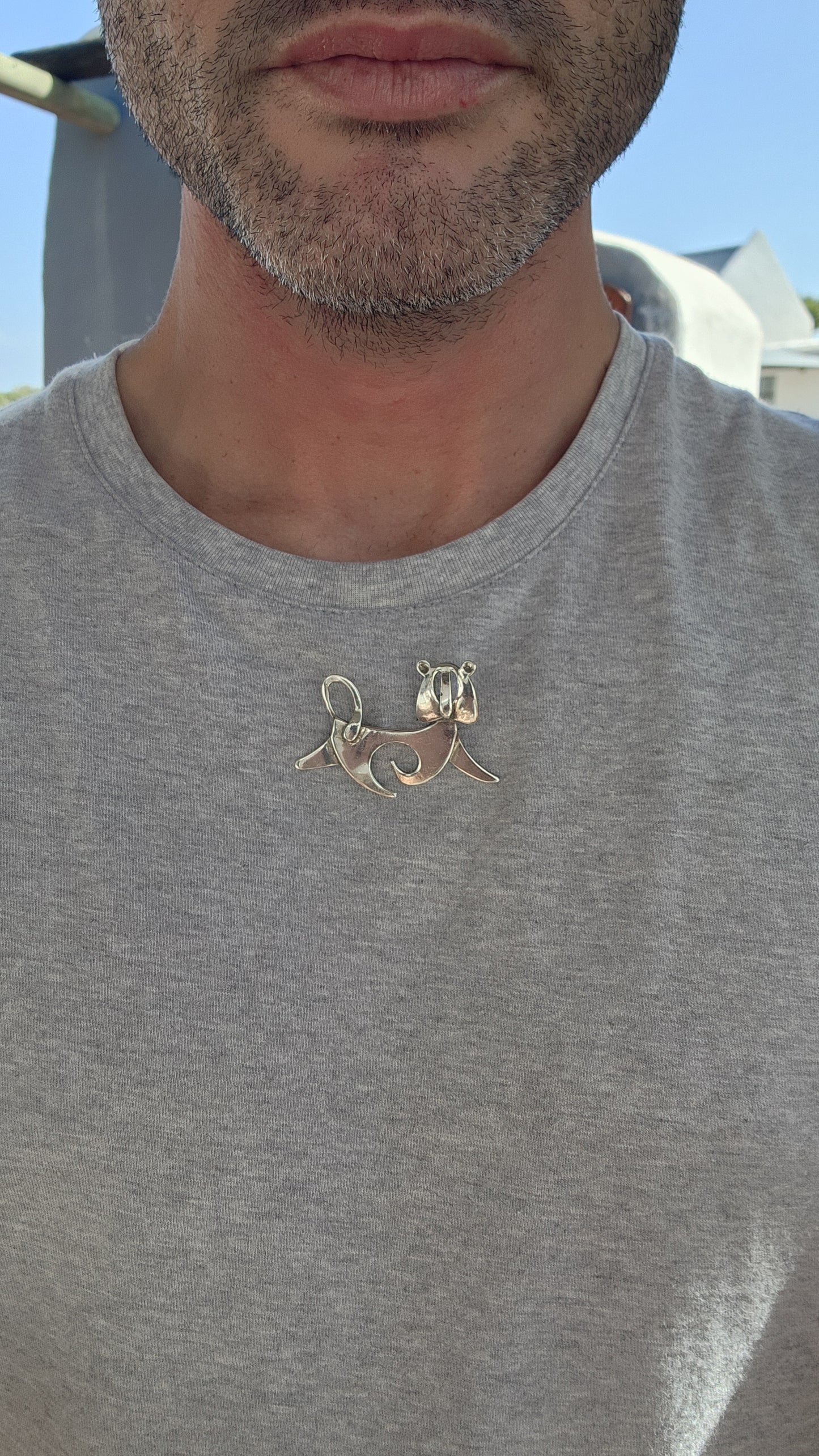 This mid-century modernist lion brooch is a striking and whimsical piece of wearable art, blending clean, abstract design with playful charm.