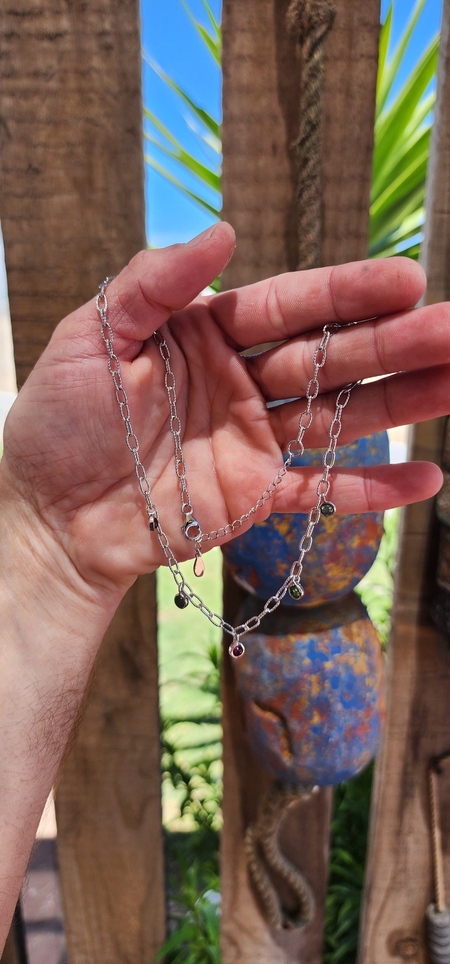 This sterling silver necklace is like a little party for your neckline! It’s a playful yet sophisticated design that feels like it belongs to someone who dances between elegance and whimsy.