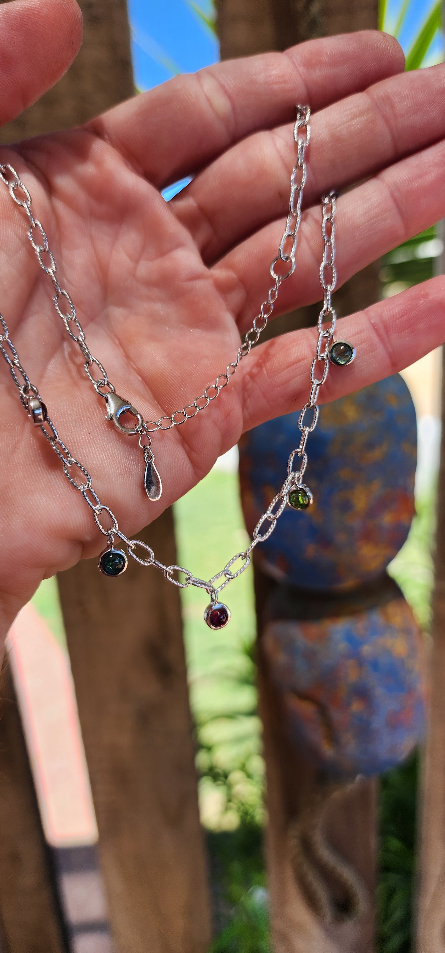 This sterling silver necklace is like a little party for your neckline! It’s a playful yet sophisticated design that feels like it belongs to someone who dances between elegance and whimsy.