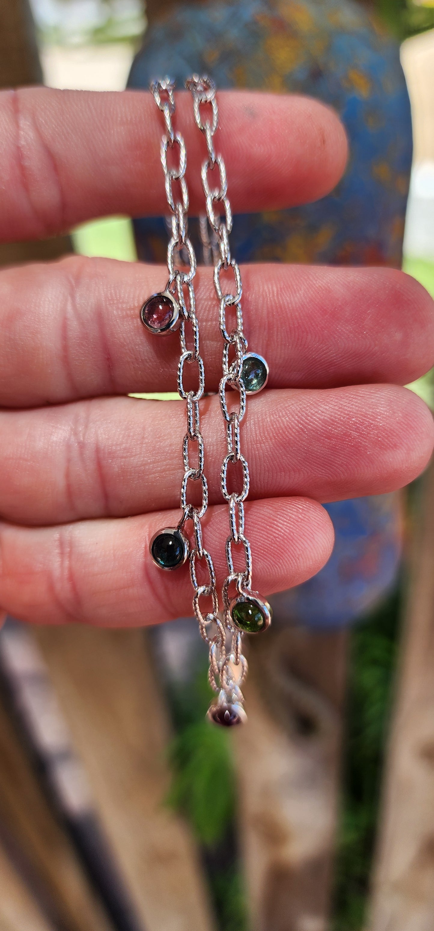 This sterling silver necklace is like a little party for your neckline! It’s a playful yet sophisticated design that feels like it belongs to someone who dances between elegance and whimsy.