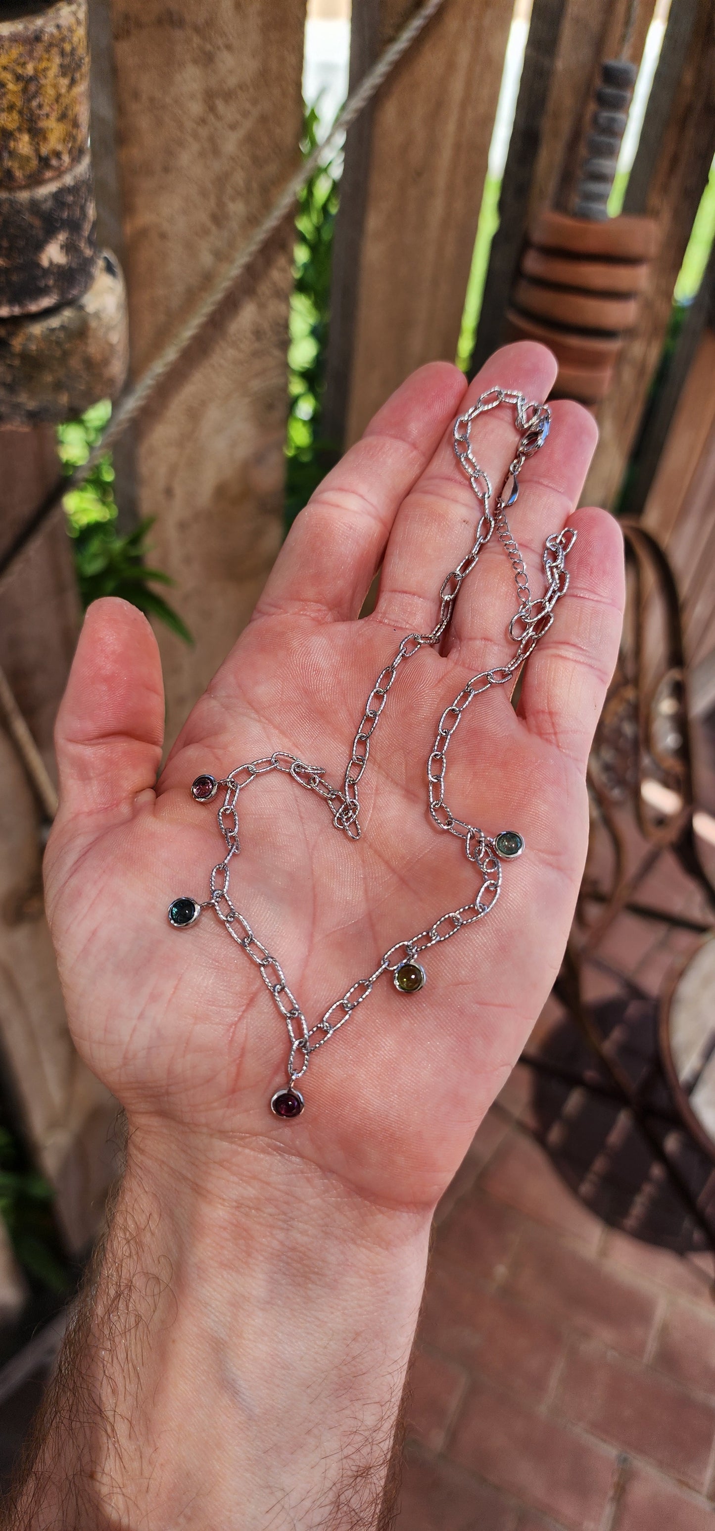 This sterling silver necklace is like a little party for your neckline! It’s a playful yet sophisticated design that feels like it belongs to someone who dances between elegance and whimsy.
