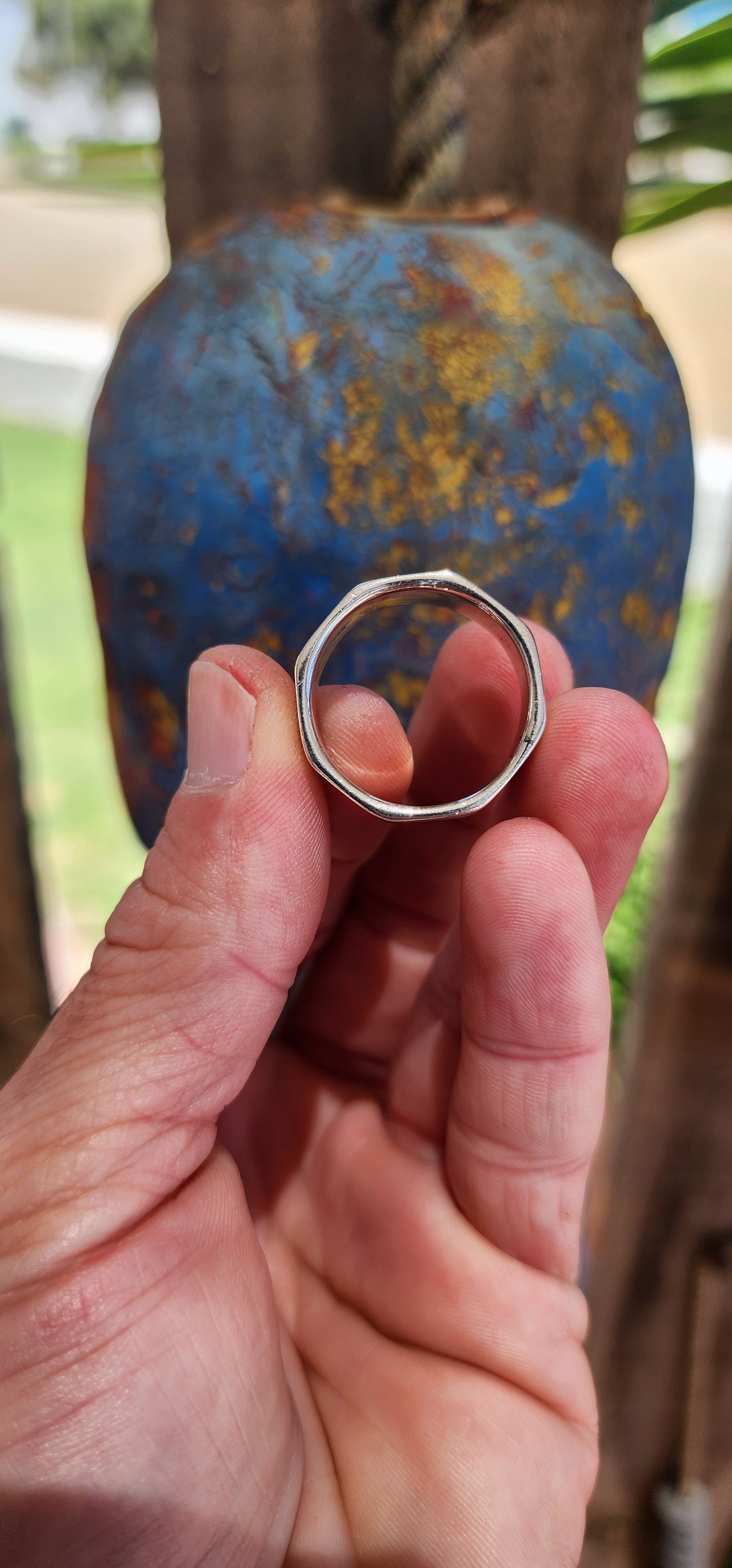 FOR THE BOYS!This chunky modernist sterling silver dress ring is a striking design, merging minimalism with industrial aesthetics. Its octagonal shape, reminiscent of a hex nut, gives it a bold and rugged look while maintaining a refined edge.