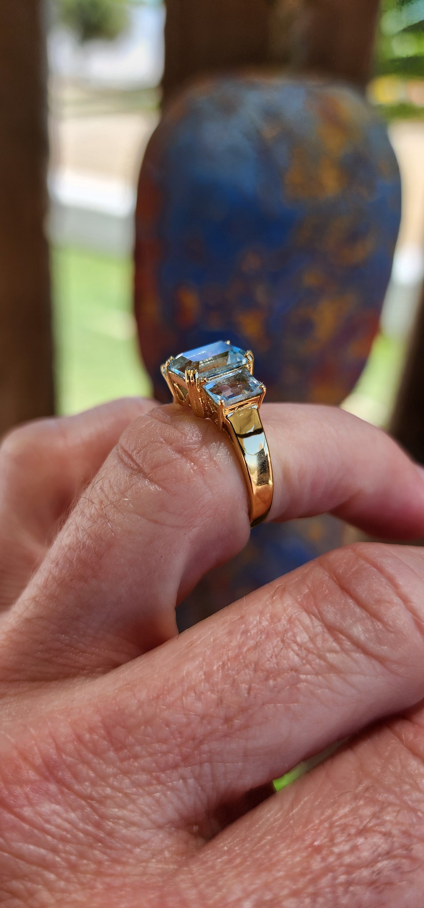This extraordinary sterling silver trilogy ring, elegantly plated with 18ct yellow gold, radiates timeless sophistication and an ethereal charm.