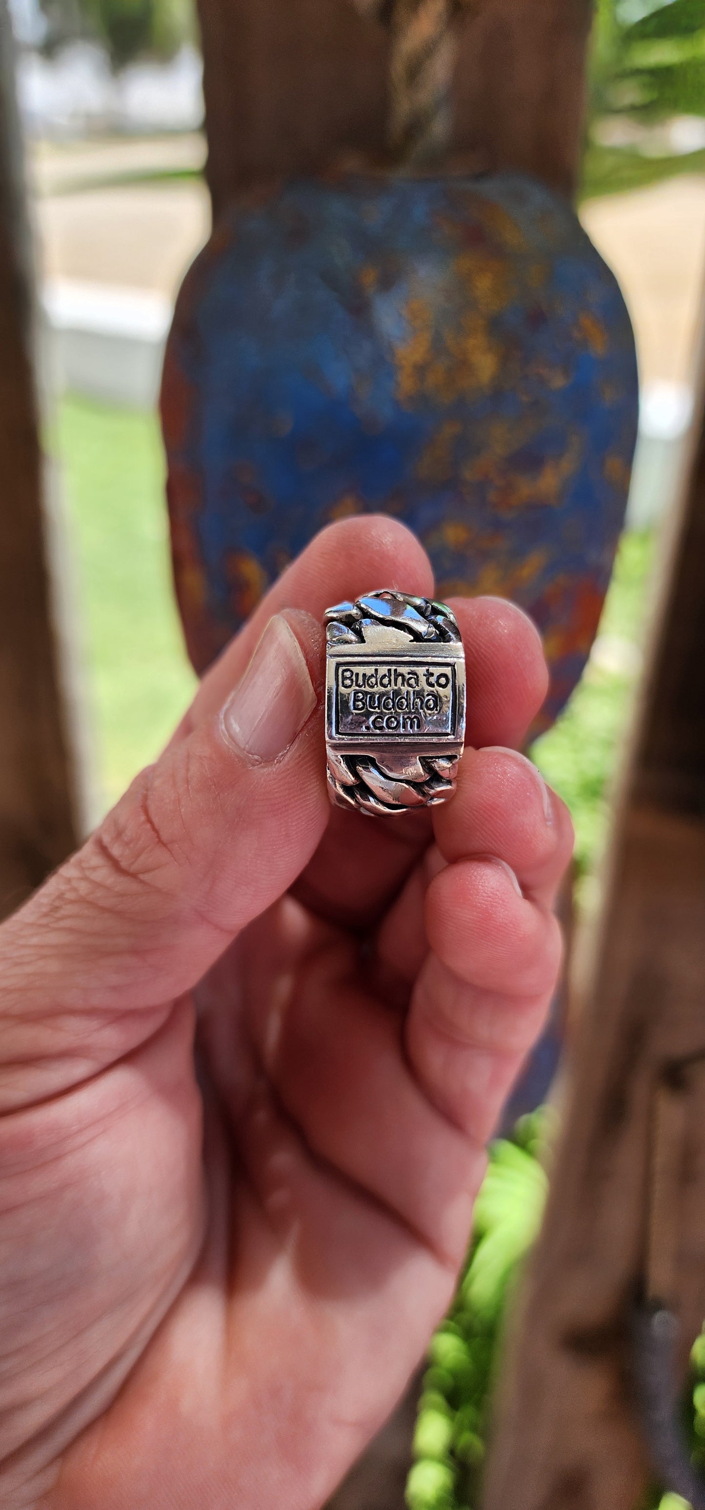The ring is a chunky sterling silver design from the Buddha to Buddha "Ben Collection",crafted for men or as a unisex piece, perfect for a bold pinky ring. The piece features a braided chain design, giving it a rugged yet polished aesthetic.
