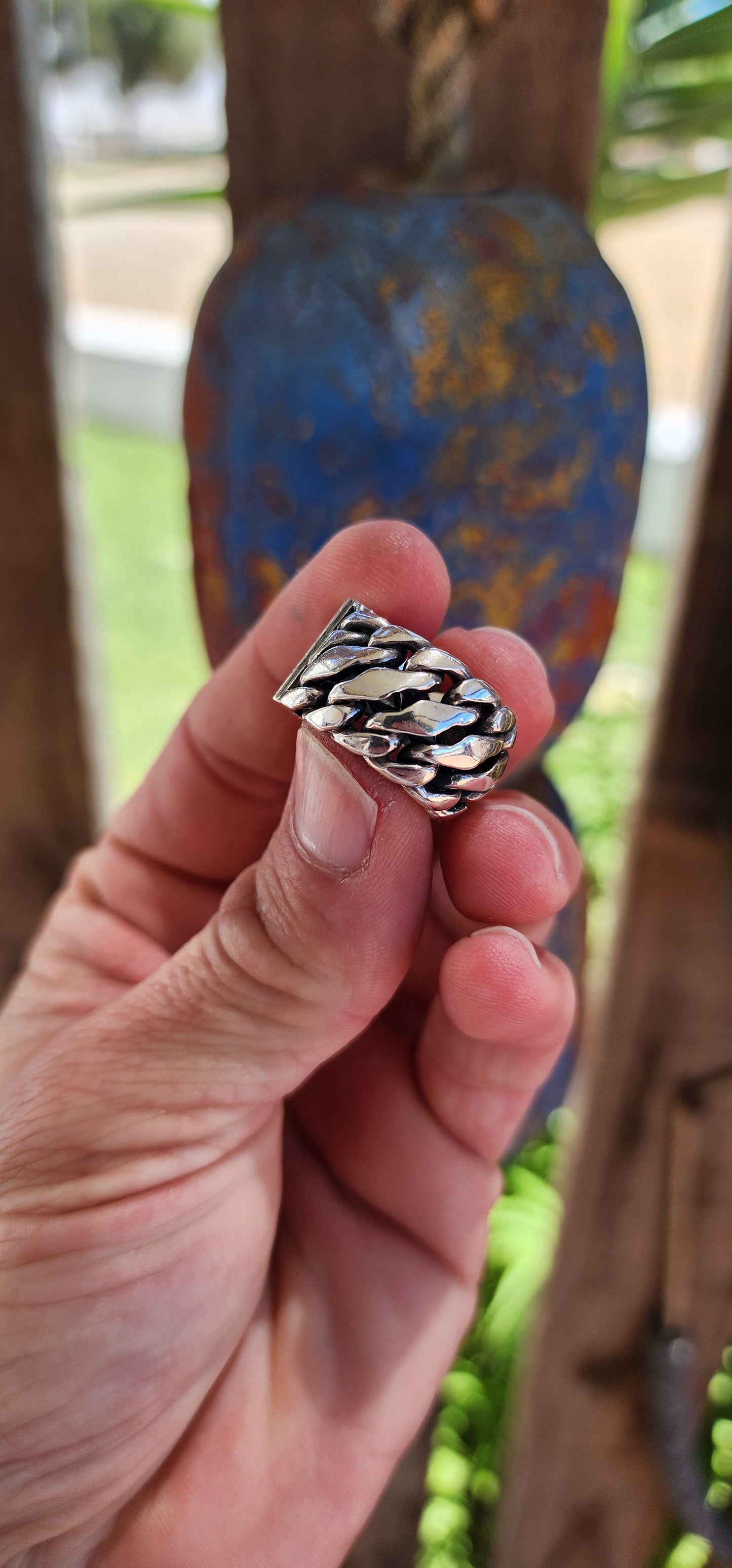 The ring is a chunky sterling silver design from the Buddha to Buddha "Ben Collection",crafted for men or as a unisex piece, perfect for a bold pinky ring. The piece features a braided chain design, giving it a rugged yet polished aesthetic.