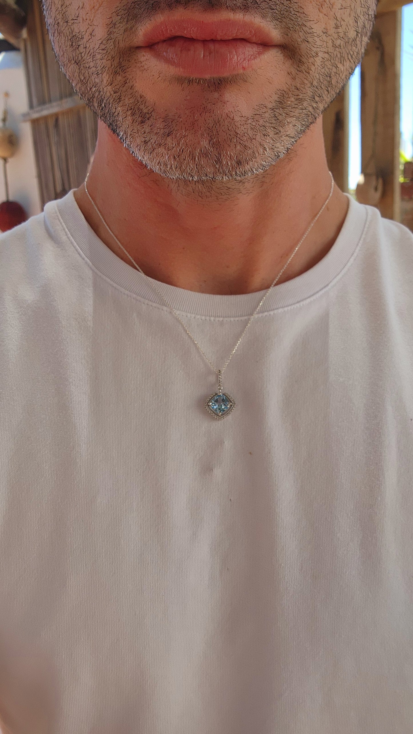This pendant is the perfect embodiment of graceful sophistication!
It features a stunning, cushion-cut sky-blue topaz as the centerpiece, a gem that radiates a serene, crystalline brilliance reminiscent of a clear summer sky.
