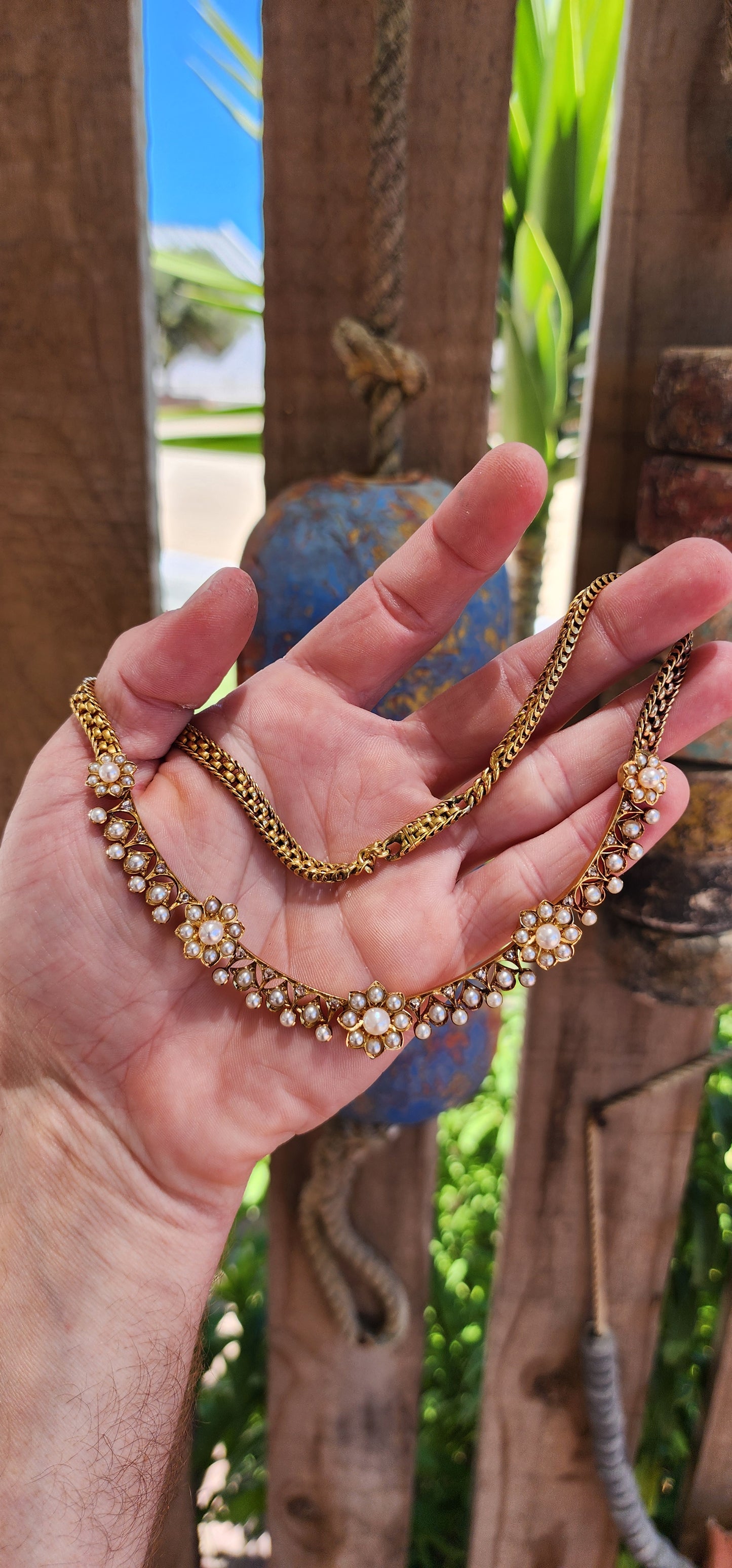 This magnificent antique necklace is a Victorian-era masterpiece crafted in solid 18ct yellow gold, featuring marine cultured pearls and old rose-cut diamonds.