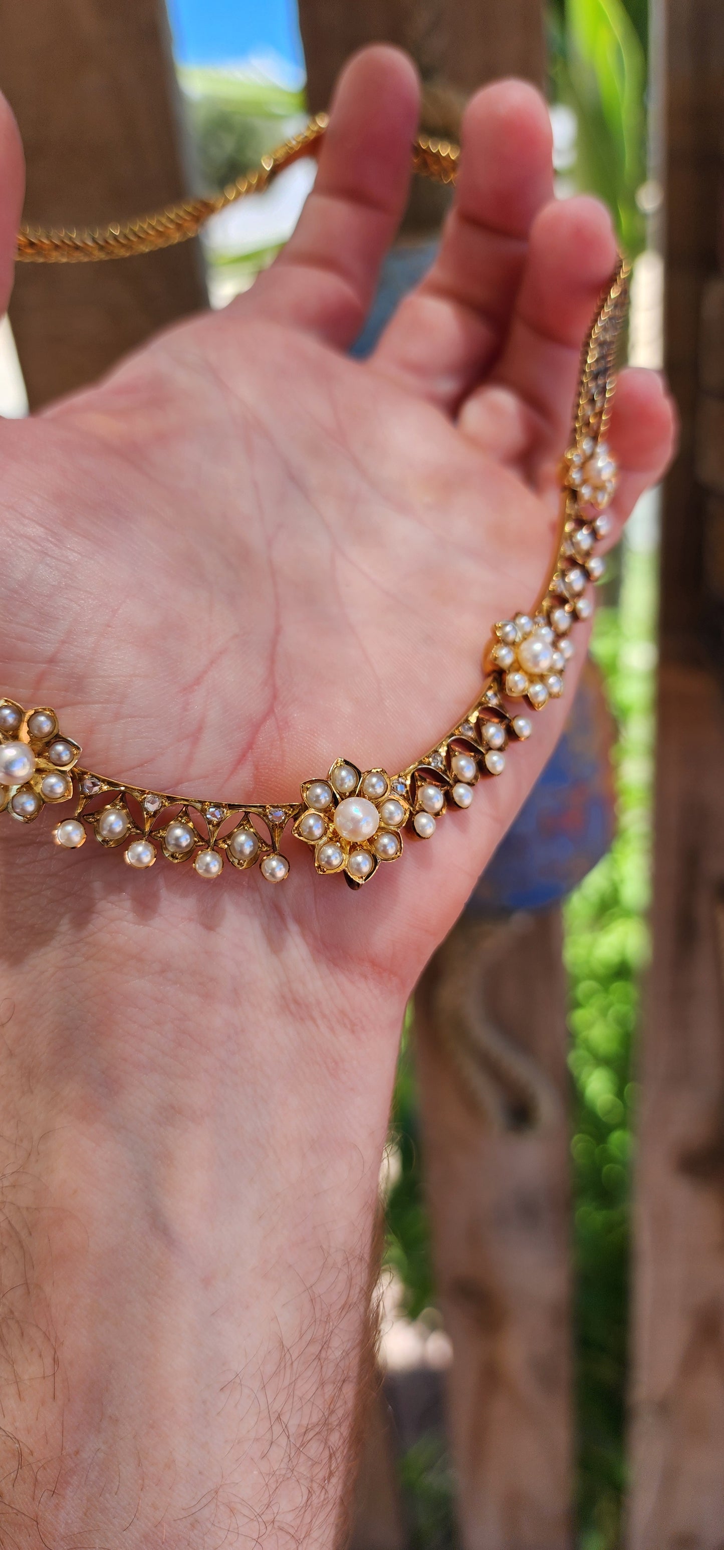 This magnificent antique necklace is a Victorian-era masterpiece crafted in solid 18ct yellow gold, featuring marine cultured pearls and old rose-cut diamonds.