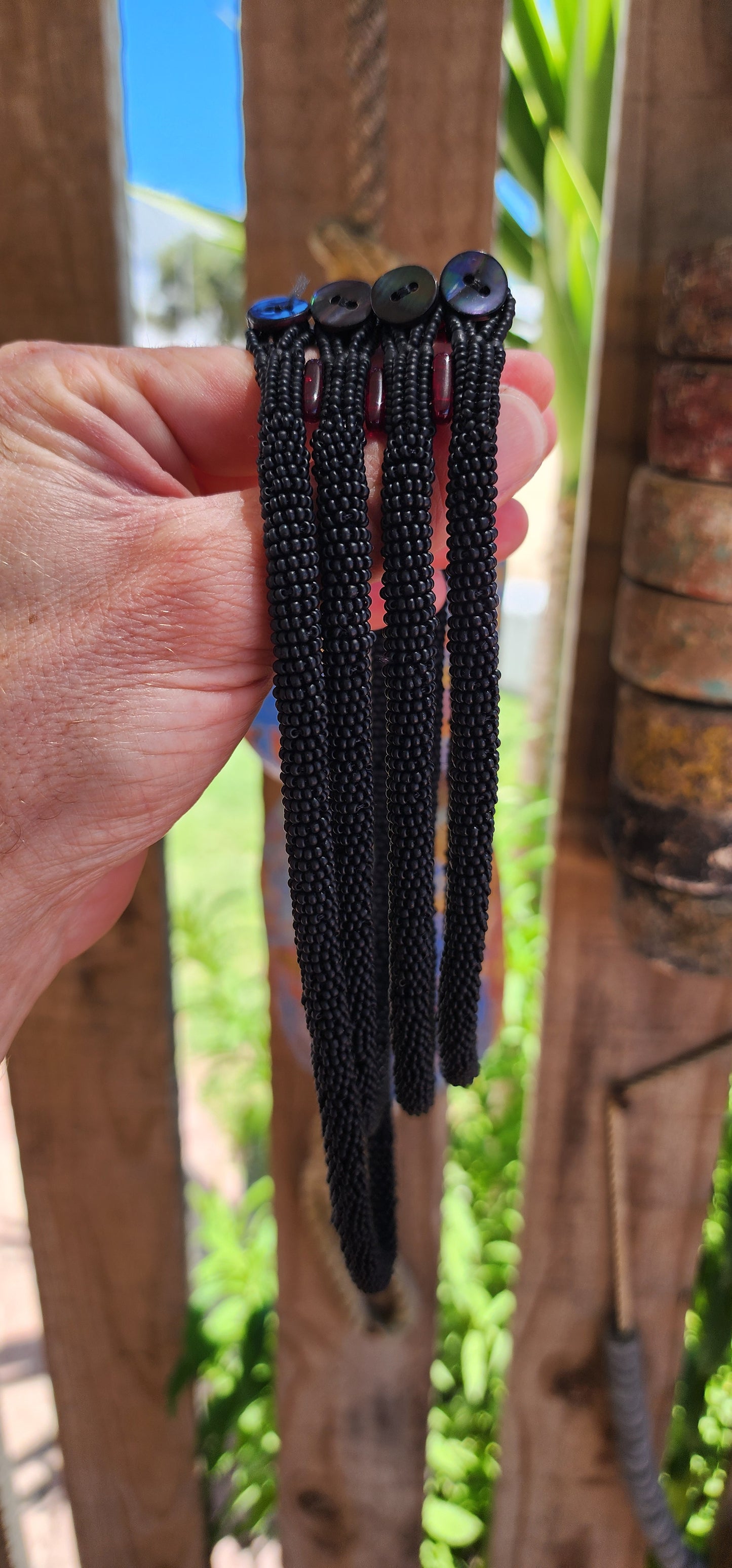 This exquisite handcrafted choker necklace is a true testament to skilled artistry and precision. Featuring four strands of finely detailed tubular crochet beadwork.