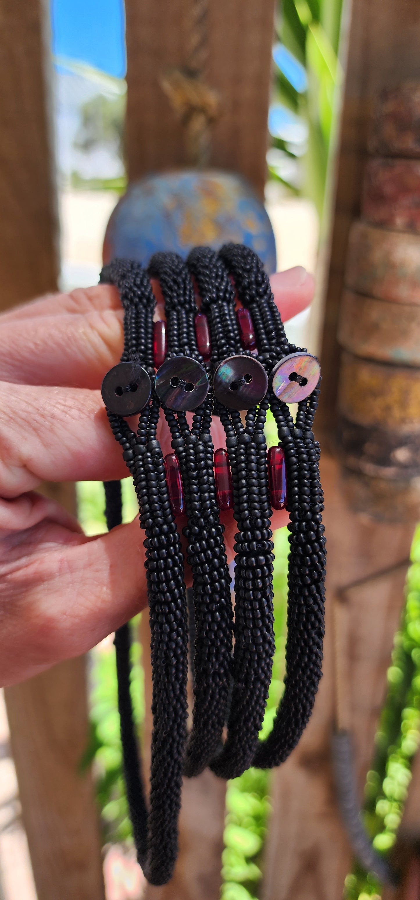 This exquisite handcrafted choker necklace is a true testament to skilled artistry and precision. Featuring four strands of finely detailed tubular crochet beadwork.