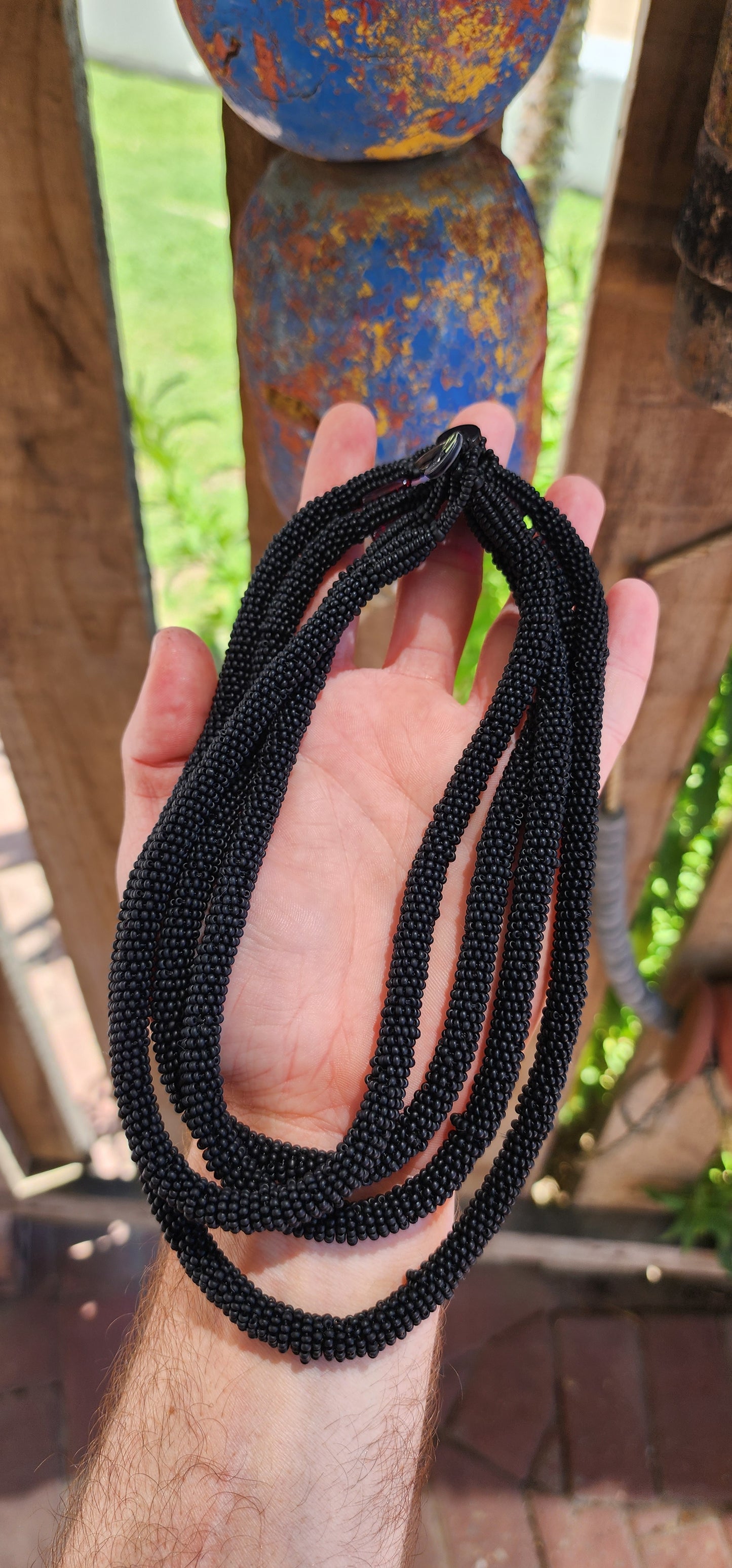 This exquisite handcrafted choker necklace is a true testament to skilled artistry and precision. Featuring four strands of finely detailed tubular crochet beadwork.