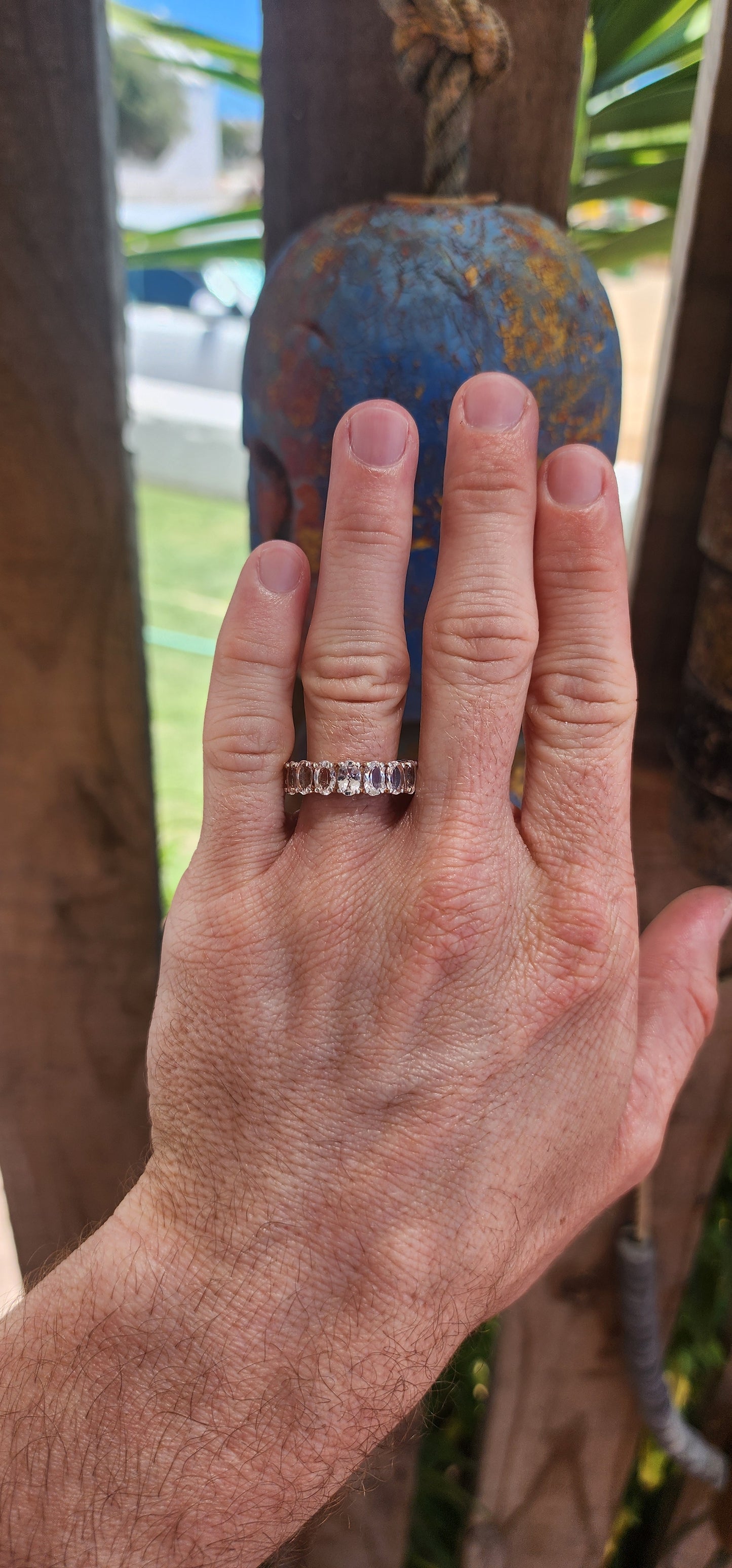This exquisite full eternity ring is a true statement of refined elegance and beauty. Crafted from sterling silver, it features 17 oval-cut morganite gemstones, each meticulously prong-set in a continuous, seamless band.