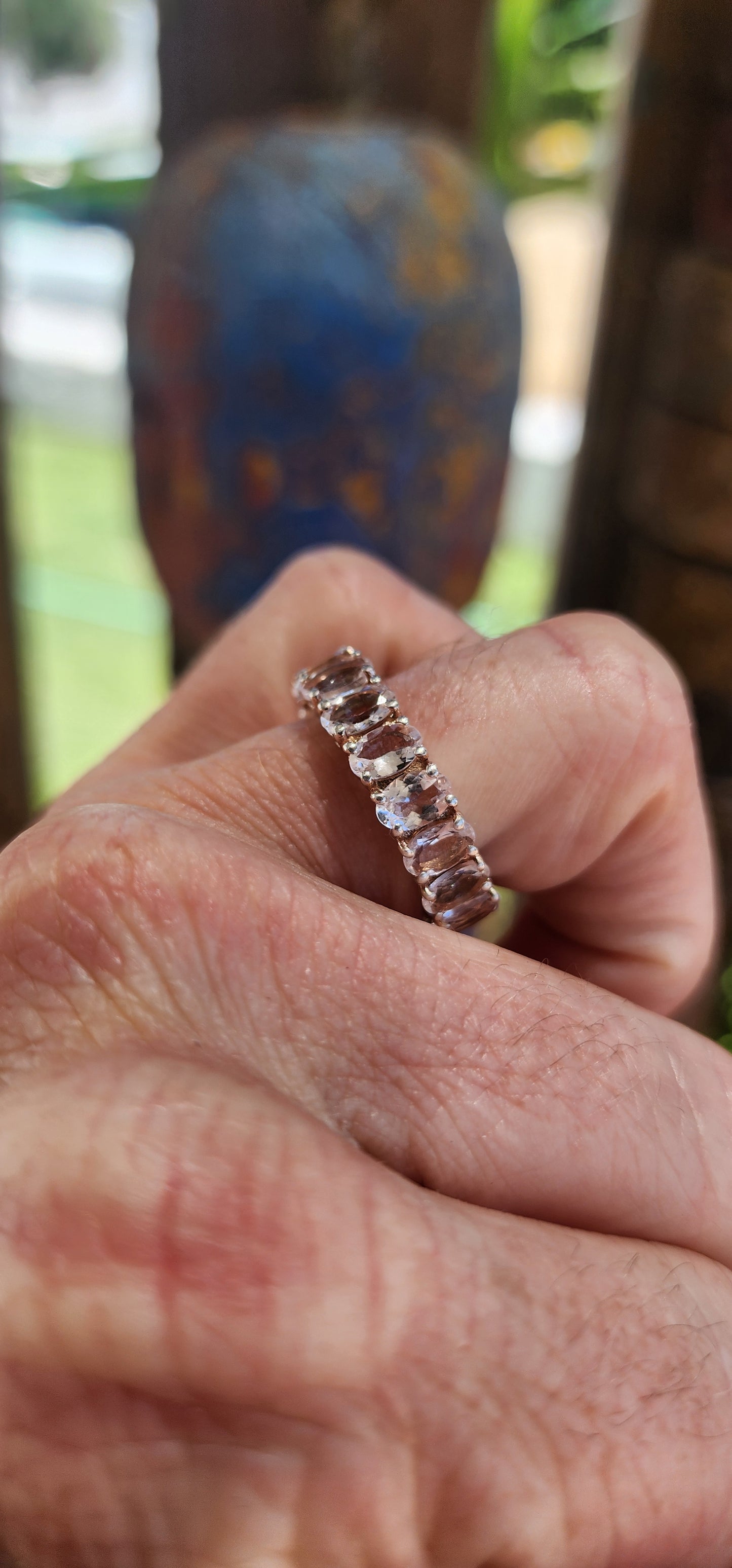 This exquisite full eternity ring is a true statement of refined elegance and beauty. Crafted from sterling silver, it features 17 oval-cut morganite gemstones, each meticulously prong-set in a continuous, seamless band.