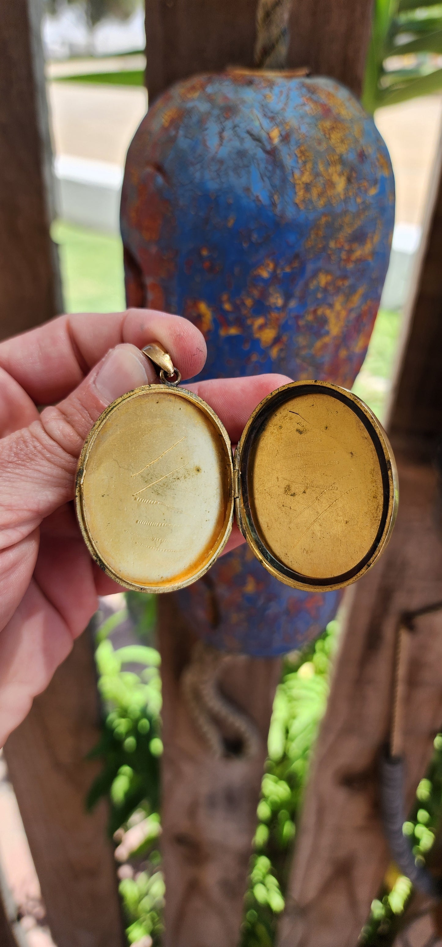 This remarkable piece is a large Victorian-era brass sweetheart locket, crafted in an elegant oval form and adorned with a striking raised monogram, "AEI." Standing for Amity (Affinity), Eternity, and Infinity.