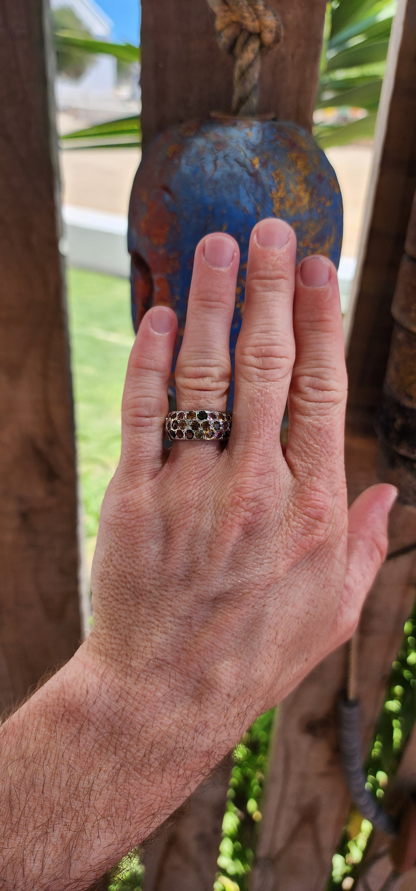 This full eternity ring is like a miniature carnival for your hand—a vibrant, joyful spectacle that refuses to be ignored! Its chunky domed design makes it a bold centerpiece, while the multicolored tourmalines are the stars of the show.