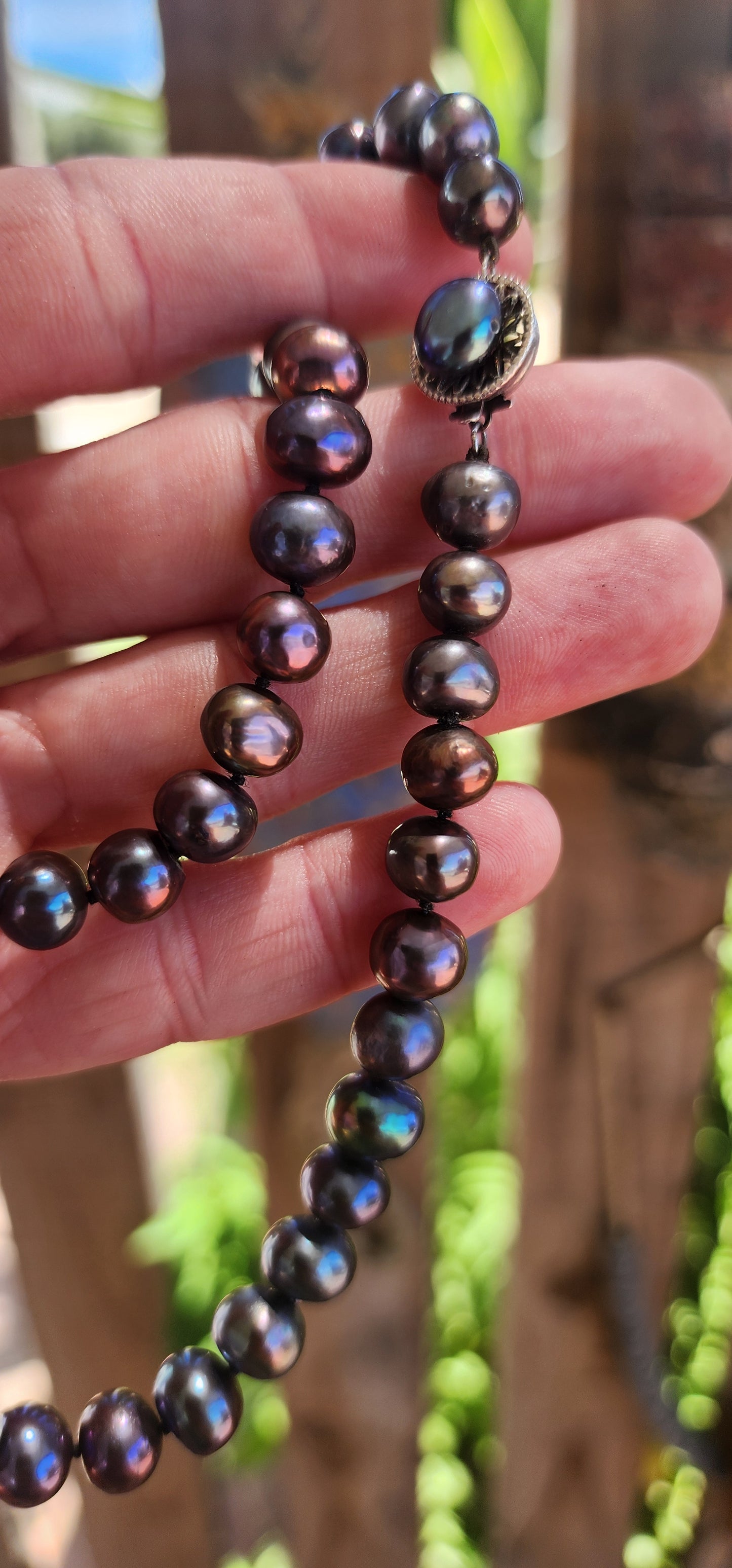 This exquisite necklace showcases the perfect harmony of nature’s beauty and artisanal craftsmanship. Composed of hand-selected freshwater black pearls, each pearl is a semi-round freeform shape, offering a unique and organic aesthetic.