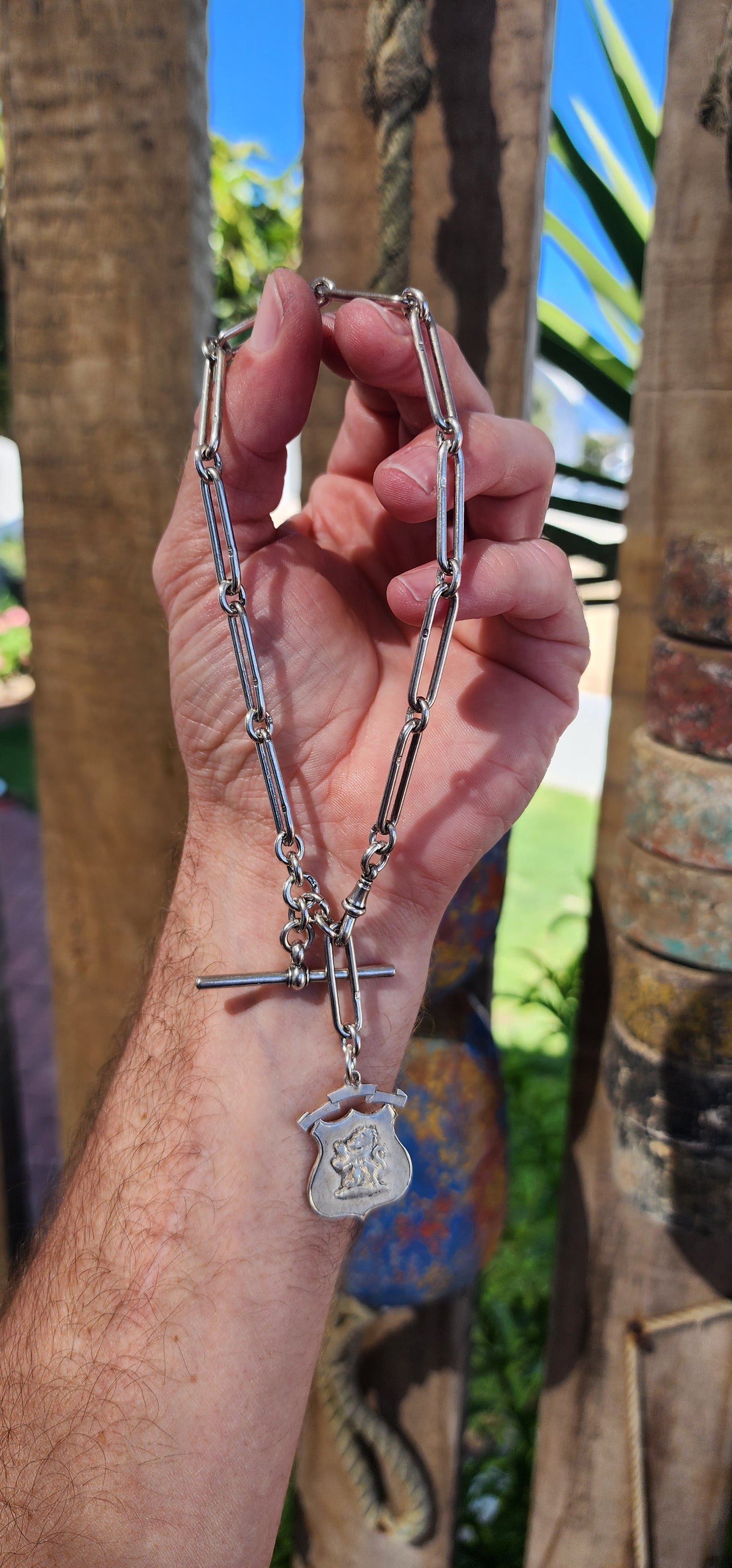 This exquisite sterling silver fob chain, crafted circa 1916 by the distinguished silversmith Joseph Moore of Birmingham, is a masterful representation of Edwardian elegance and functionality.
