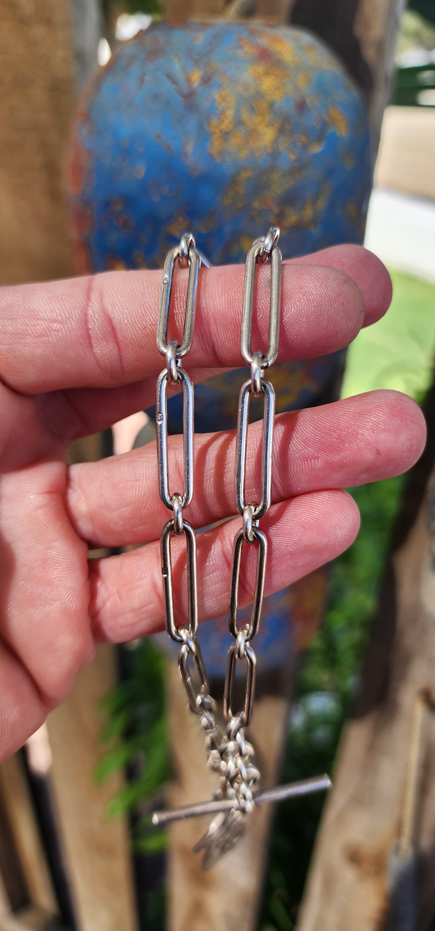 This exquisite sterling silver fob chain, crafted circa 1916 by the distinguished silversmith Joseph Moore of Birmingham, is a masterful representation of Edwardian elegance and functionality.